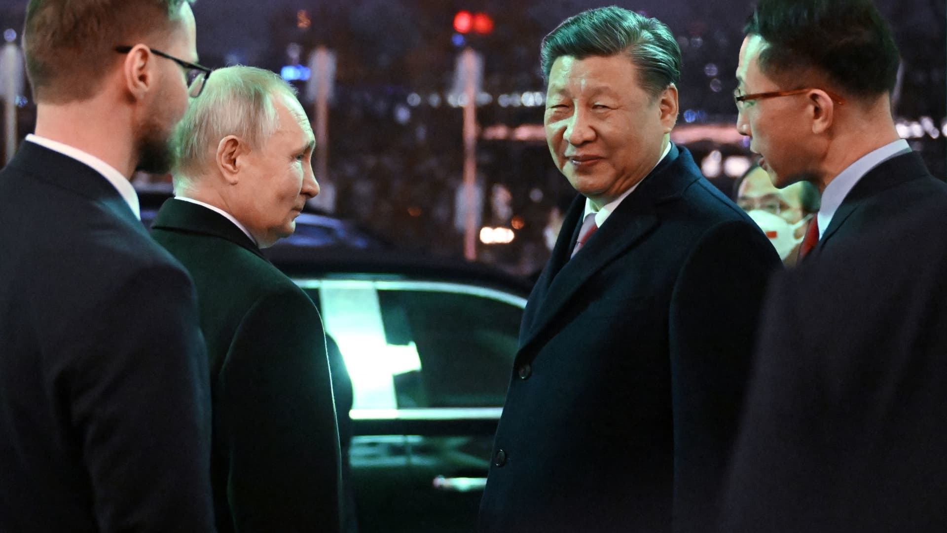 Russian President Vladimir Putin and Chinese President Xi Jinping leave after a reception in honor of the Chinese leader's visit to the Kremlin in Moscow on March 21, 2023.