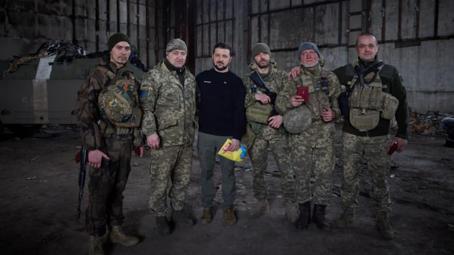 BAKHMUT, UKRAINE - MARCH 22: (----EDITORIAL USE ONLY ? MANDATORY CREDIT - 'UKRAINIAN PRESIDENCY / HANDOUT' - NO MARKETING NO ADVERTISING CAMPAIGNS - DISTRIBUTED AS A SERVICE TO CLIENTS----) Ukrainian President Volodymyr Zelenskyy (3rd L) poses for a photo with Ukrainian soldiers during his visit to Bakhmut frontline Russia-Ukraine war in Donetsk region, Bakhmut, Ukraine on March 22, 2023. (Photo by Ukrainian Presidency / Handout/Anadolu Agency via Getty Images)