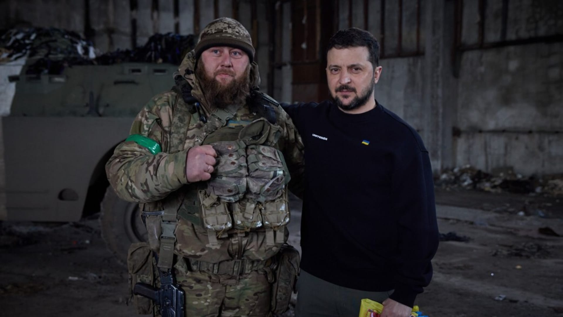  Ukrainian President Volodymyr Zelenskyy (R) poses for a photo with a Ukrainian soldier during his visit to Bakhmut frontline amid Russia-Ukraine war in Donetsk region, Bakhmut, Ukraine on March 22, 2023. 