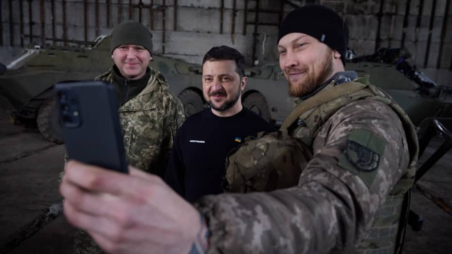 BAKHMUT, UKRAINE - MARCH 22: (----EDITORIAL USE ONLY ? MANDATORY CREDIT - 'UKRAINIAN PRESIDENCY / HANDOUT' - NO MARKETING NO ADVERTISING CAMPAIGNS - DISTRIBUTED AS A SERVICE TO CLIENTS----) Ukrainian President Volodymyr Zelenskyy (C) poses for a photo with Ukrainian soldiers during his visit to Bakhmut frontline amid Russia-Ukraine war in Donetsk region, Bakhmut, Ukraine on March 22, 2023. (Photo by Ukrainian Presidency / Handout/Anadolu Agency via Getty Images)