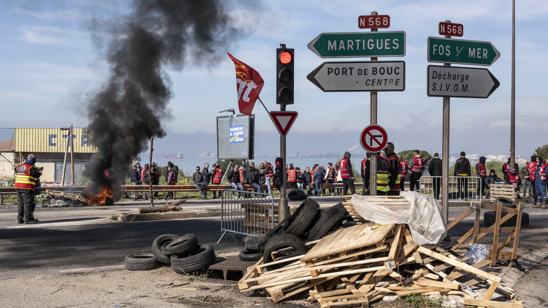 Striking members of the General Confederation of Labour (CGT) union set up fires and blockades en route to the industrial and port area of Fos-sur-Mer, France, on Wednesday, March 22, 2023. France released strategic stockpiles of oil products this month as the latest round of strike action over pension reforms hobbles the nation's fuel distribution network.