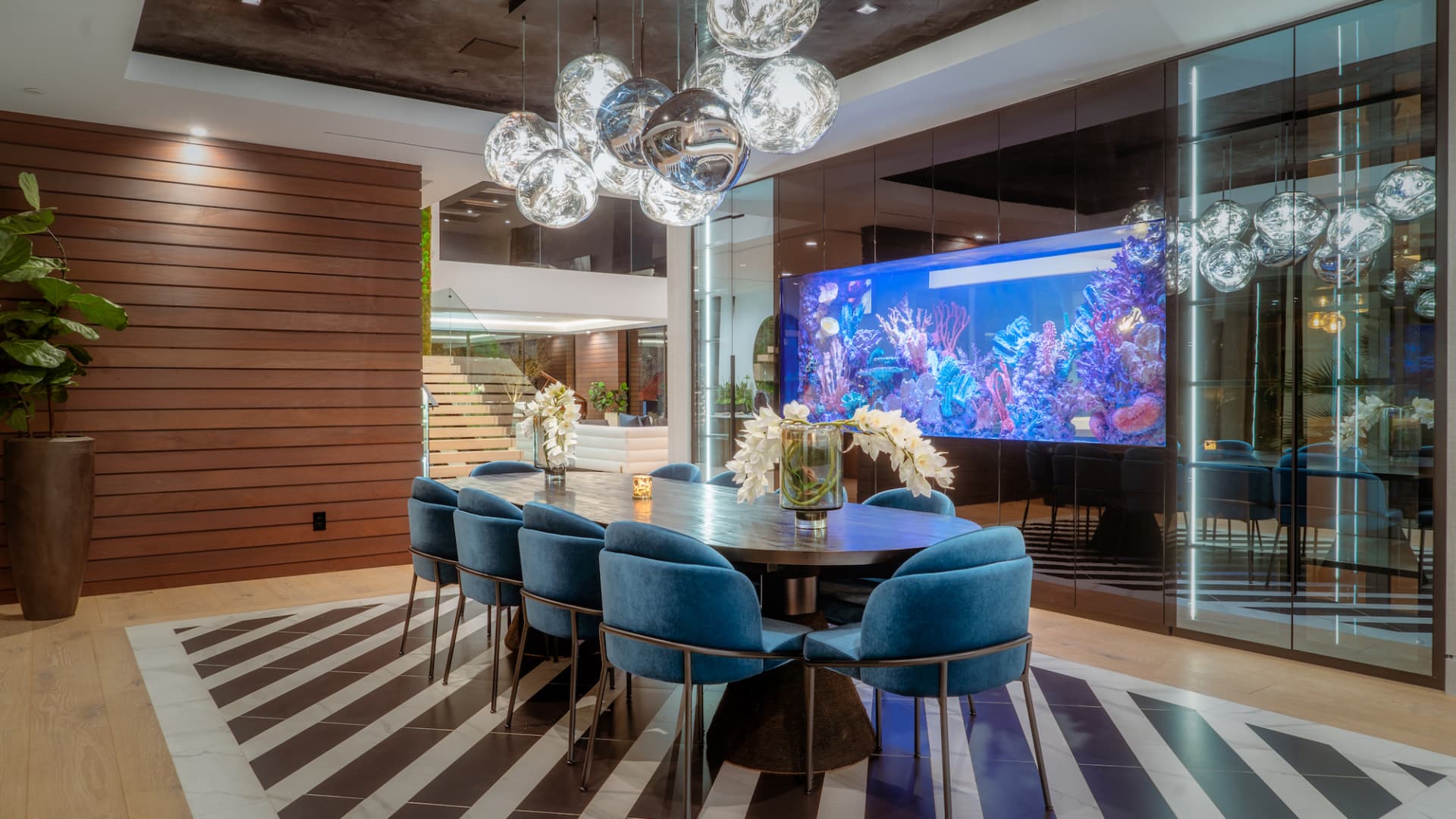 One wall of the dining room is a 1,000 gallon salt water aquarium with views into the kitchen on the other side.