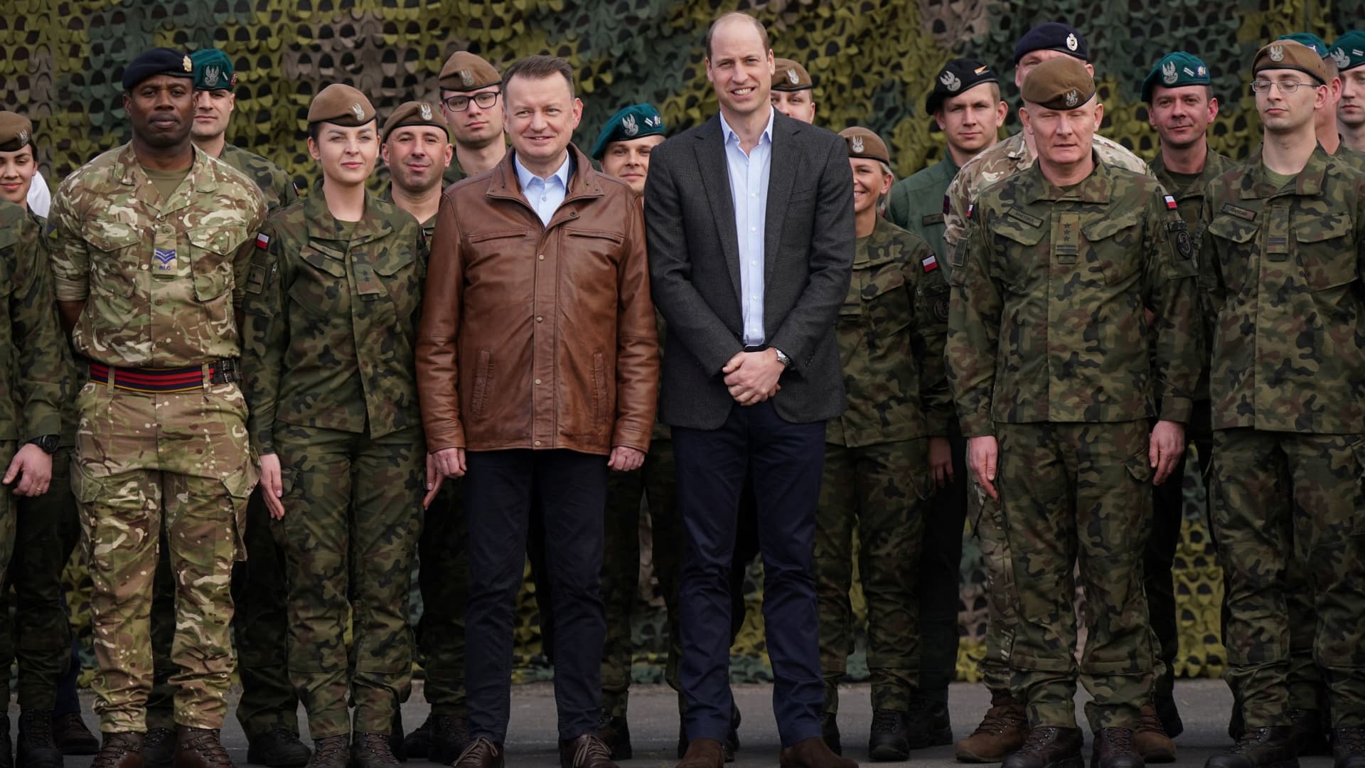 The Prince of Wales (centre right) and Polish Deputy Prime Minister and Minister of National Defence, Mariusz Blaszczak (centre left) pose for a group photo with British and Polish troops during a visit to the 3rd Brigade Territorial Defence Force base, in Rzeszow, Poland, that has been heavily involved in providing support to Ukraine. March 22, 2023. 