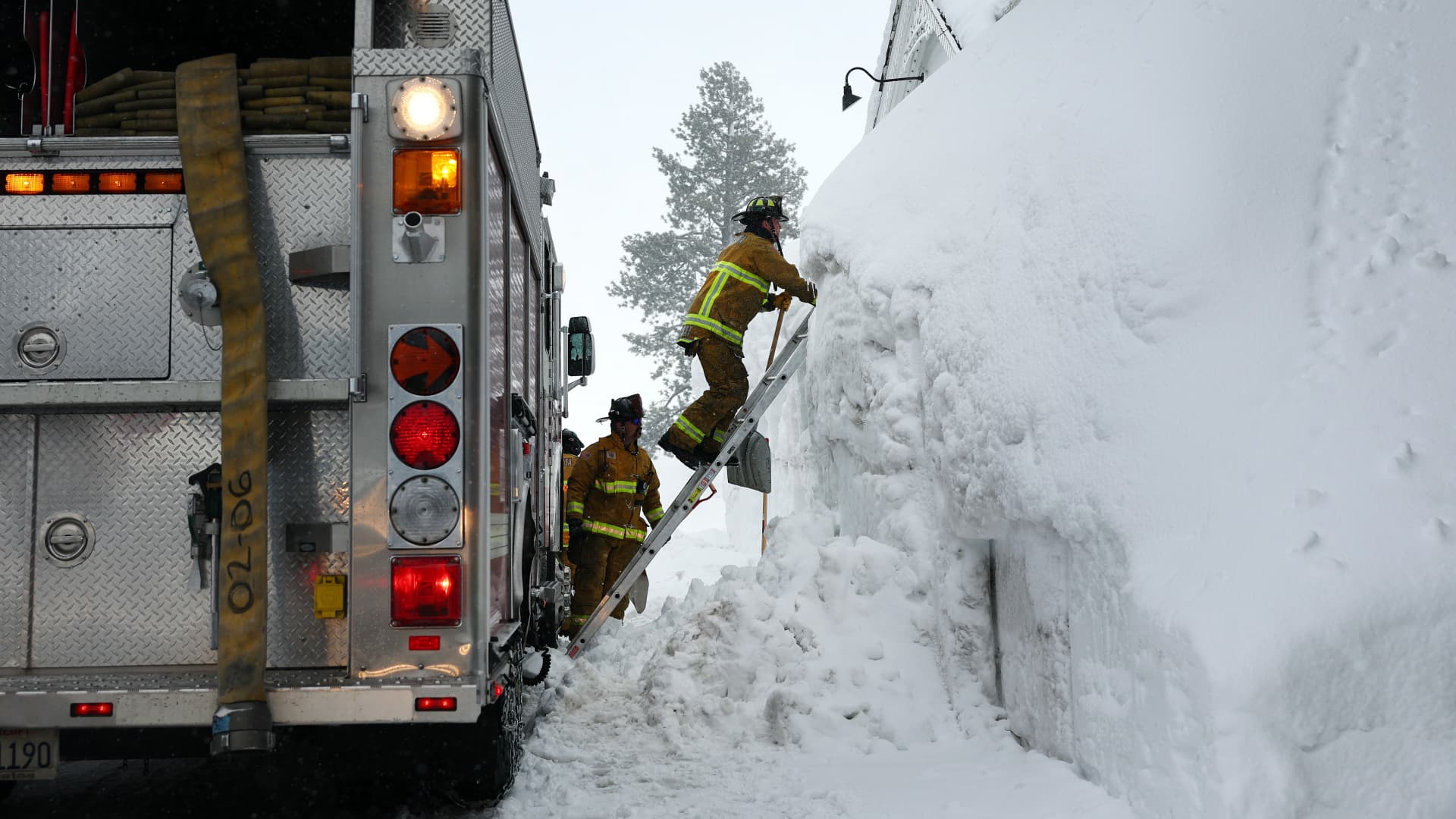 Mammoth Lakes Fire Department firefighters respond to a propane heater leak and small fire at a shuttered restaurant surrounded by snowbanks on March 12, 2023 in Mammoth Lakes, California. 