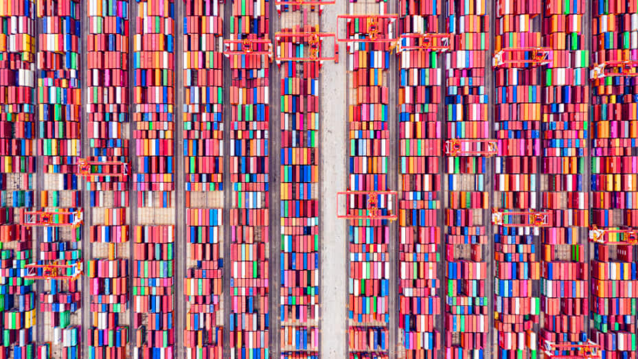 Aerial view of shipping containers sitting stacked at Yangshan Deepwater Port, the world's biggest automated container terminal, on May 21, 2021 in Shanghai, China.