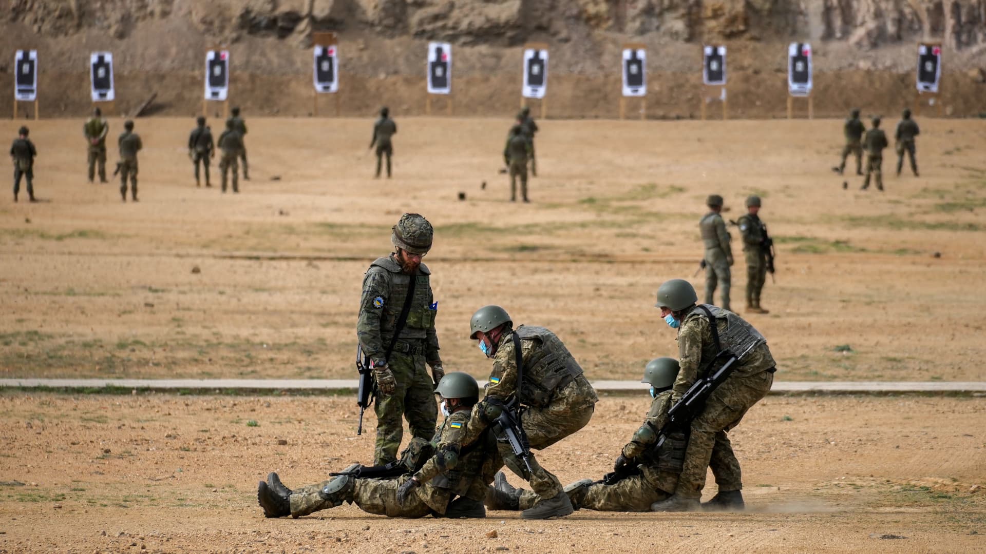Armed Ukrainian military personnel take part in a medical evacuation training exercise, conducted by the Spanish military, at the Toledo infantry academy in Toledo, Spain, on Friday, March 24, 2023. 
