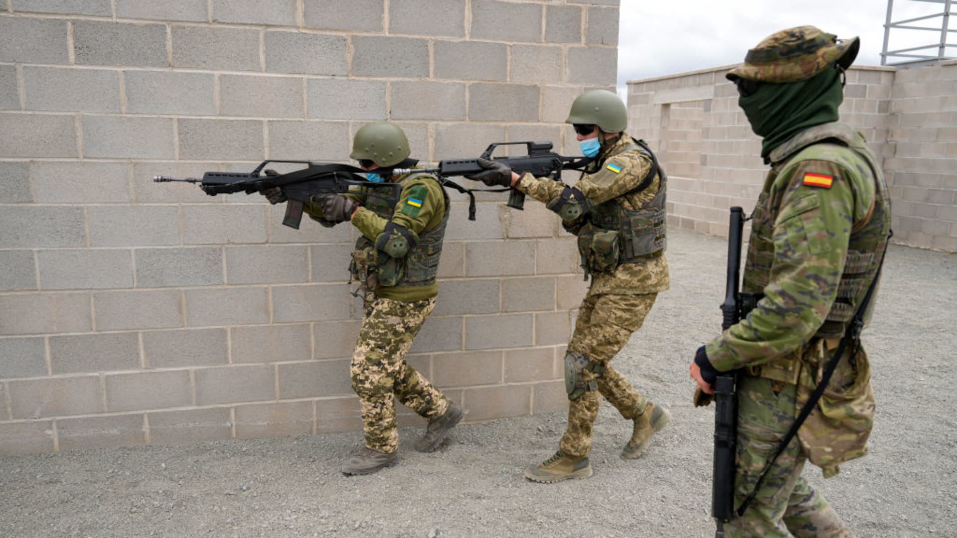 Armed Ukrainian military personnel take part in an urban warfare exercise, conducted by the Spanish military, at the Toledo infantry academy in Toledo, Spain, on Friday, March 24, 2023. 