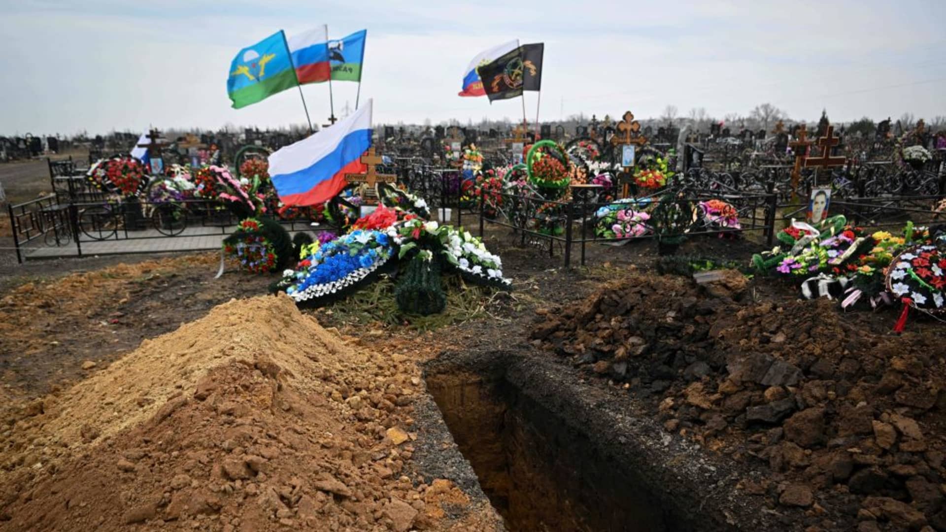 A freshly dug grave sits near tombs of Russian soldiers at a cemetery in the town of Yefremov in the Tula region on March 24, 2023. 