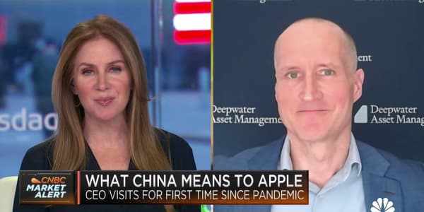 Here's what Apple CEO Tim Cook's visit to China means for the company and stock