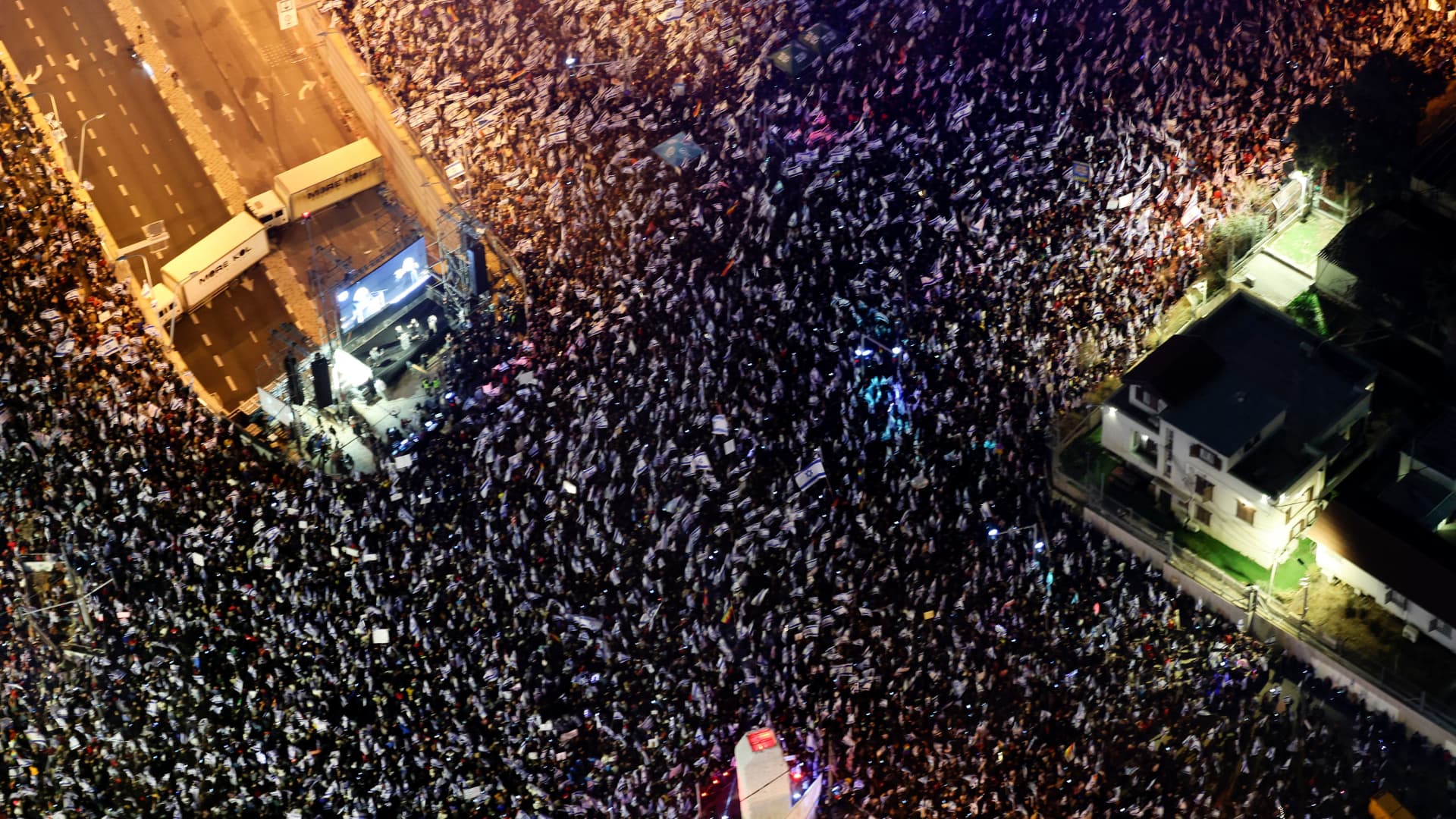 This aerial view shows people protesting in Tel Aviv against the government's controversial judicial overhaul bill, on March 25, 2023.