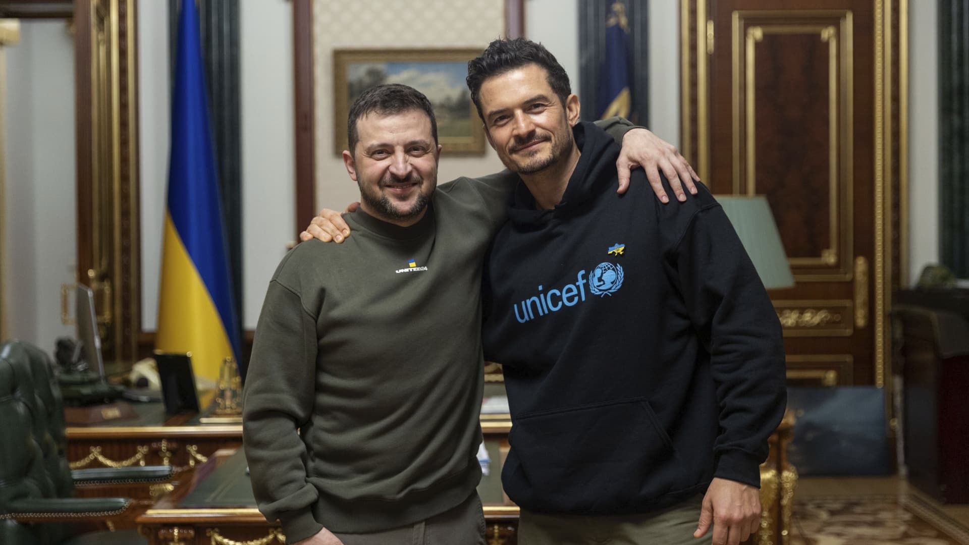 In this photo provided by the Ukrainian Presidential Press Office, Ukrainian President Volodymyr Zelenskyy, left, poses for photo with British actor and UNICEF Goodwill Ambassador Orlando Bloom during their meeting in Kyiv, Ukraine, Sunday, March 26, 2023.