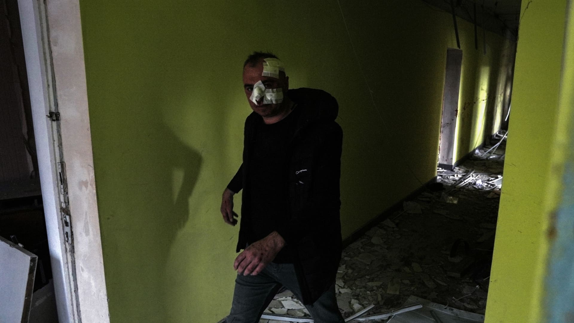 EDITORS NOTE: Image contains graphic content: A wounded man walks in the damaged building in the city centre on March 27, 2023 in Sloviansk, Ukraine. As a result of the missile attack, 2 people died and 32 were injured, administrative and office buildings, 5 high-rise buildings and 7 private houses were destroyed. 