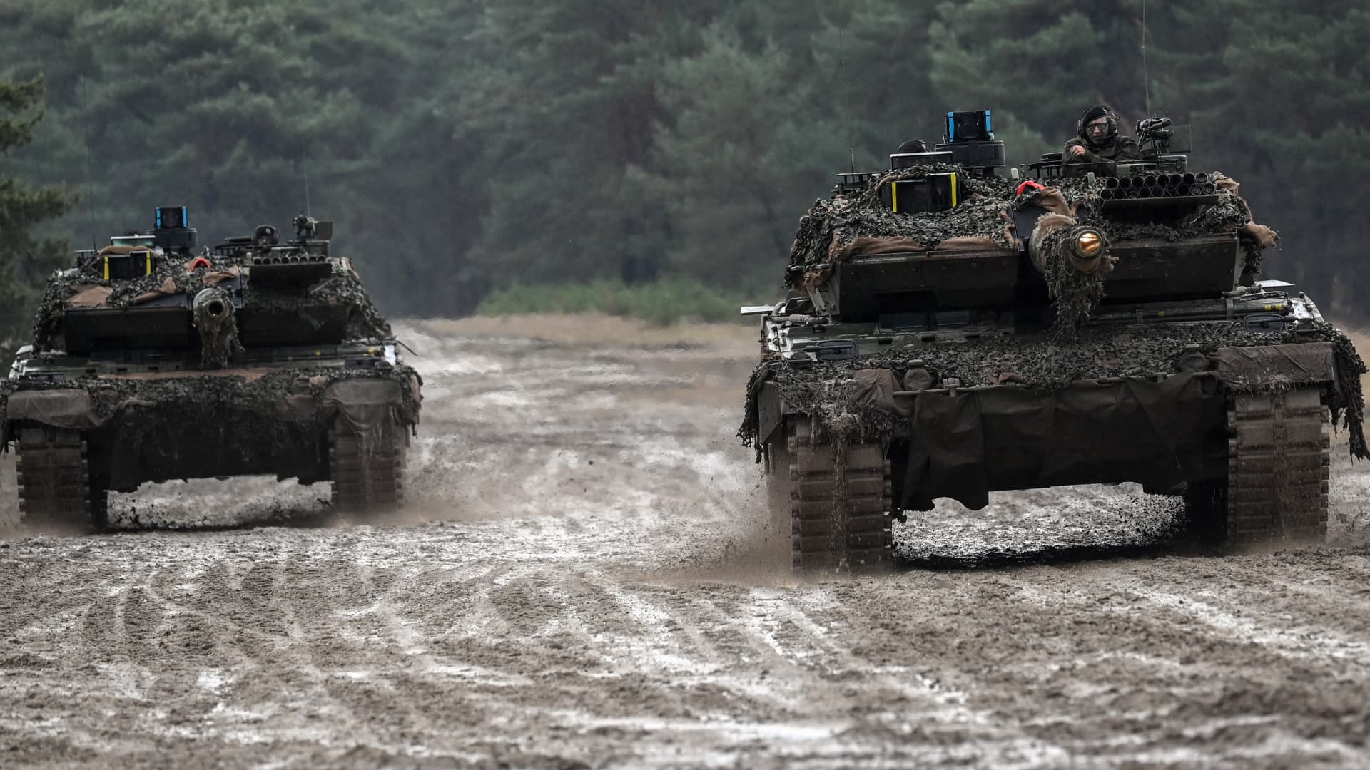 Two Leopard 2 A6 tanks from the German Army's Tank Battalion 203 drive around the training area.