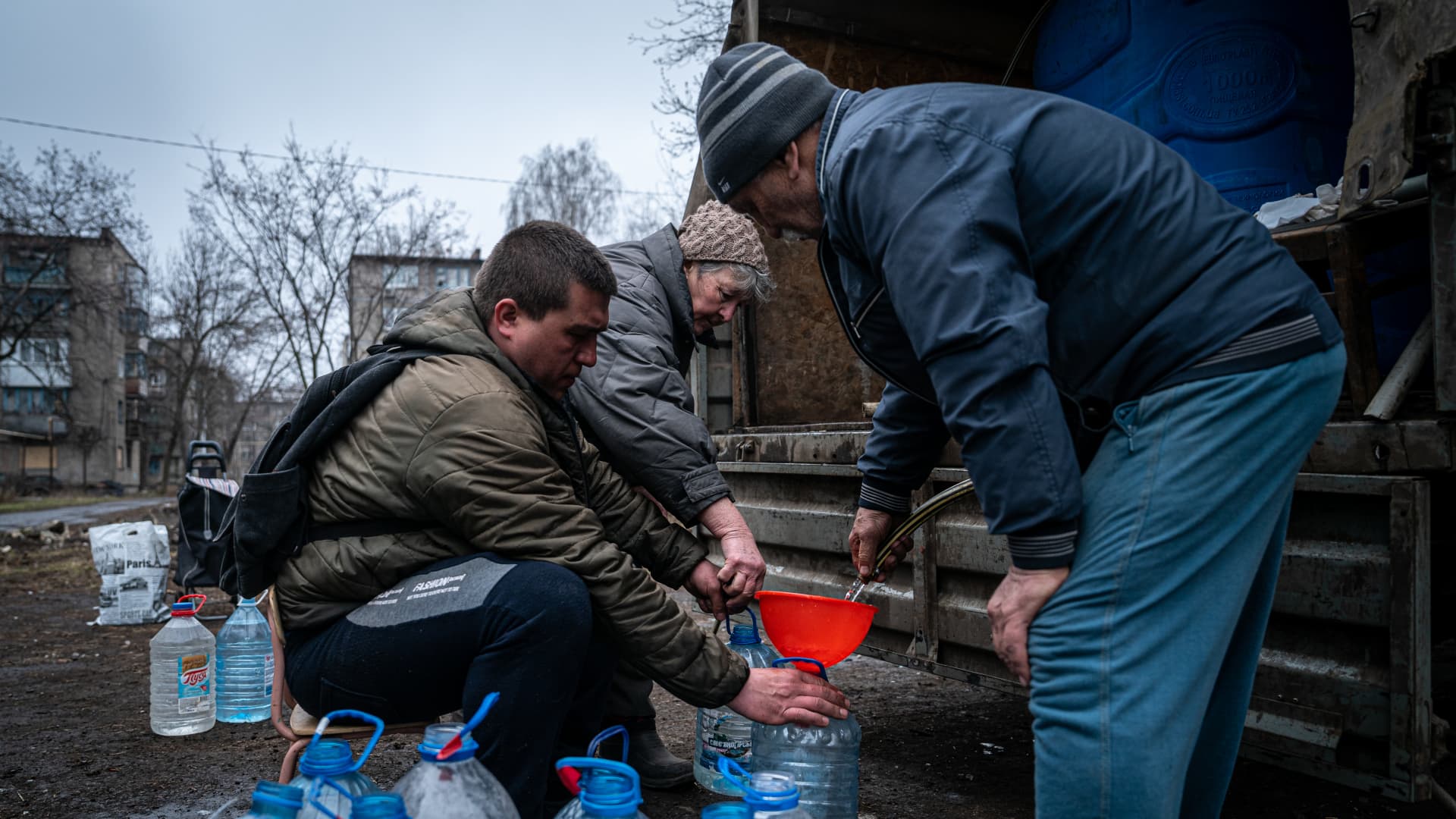 Civilians receive humanitarian aid and drinking water by volunteers amid Russian-Ukrainian war in Chasiv Yar, Ukraine, March 27 2023. 