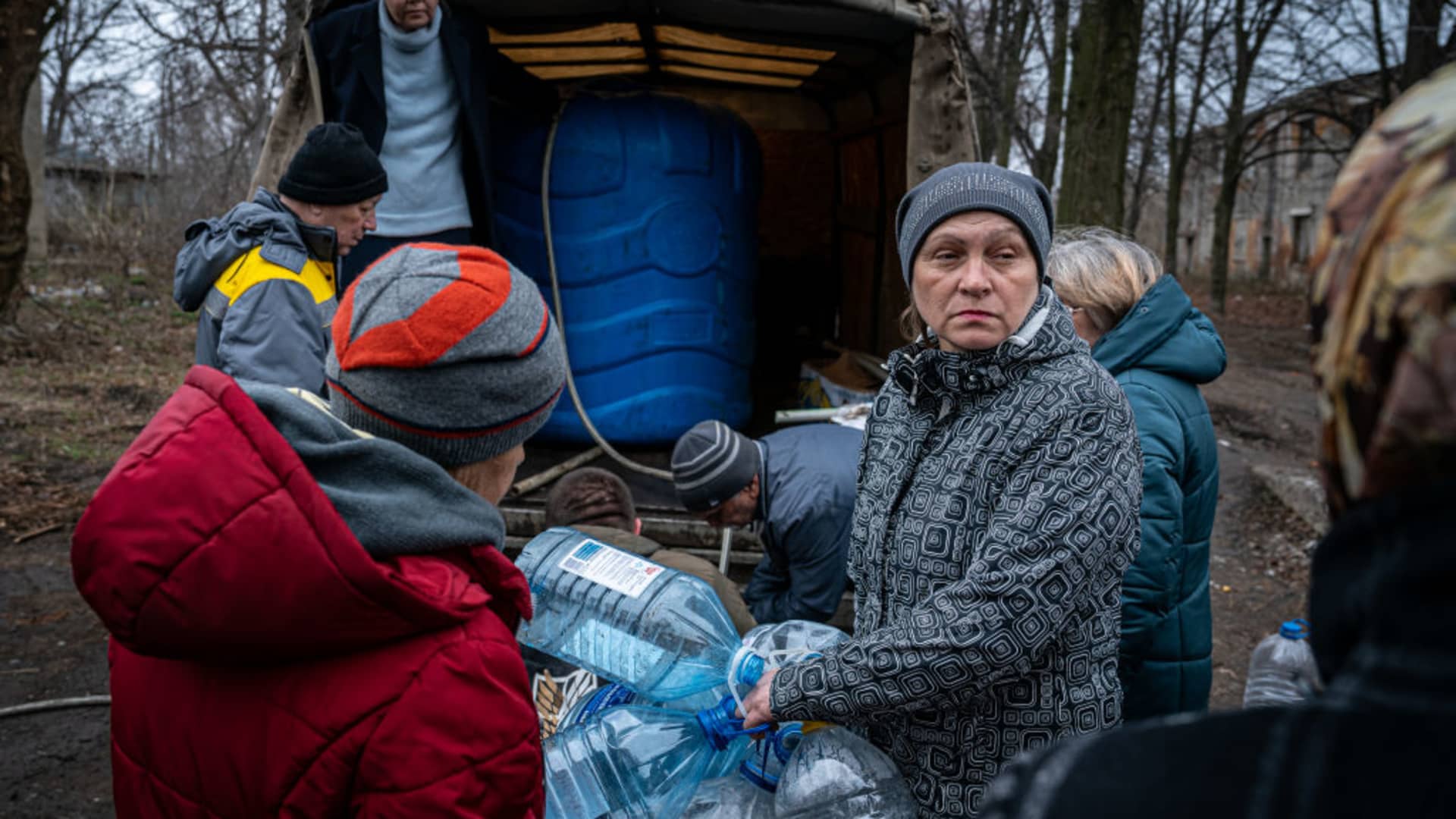 Civilians receive humanitarian aid and drinking water by volunteers amid Russian-Ukrainian war in Chasiv Yar, Ukraine, March 27 2023. 