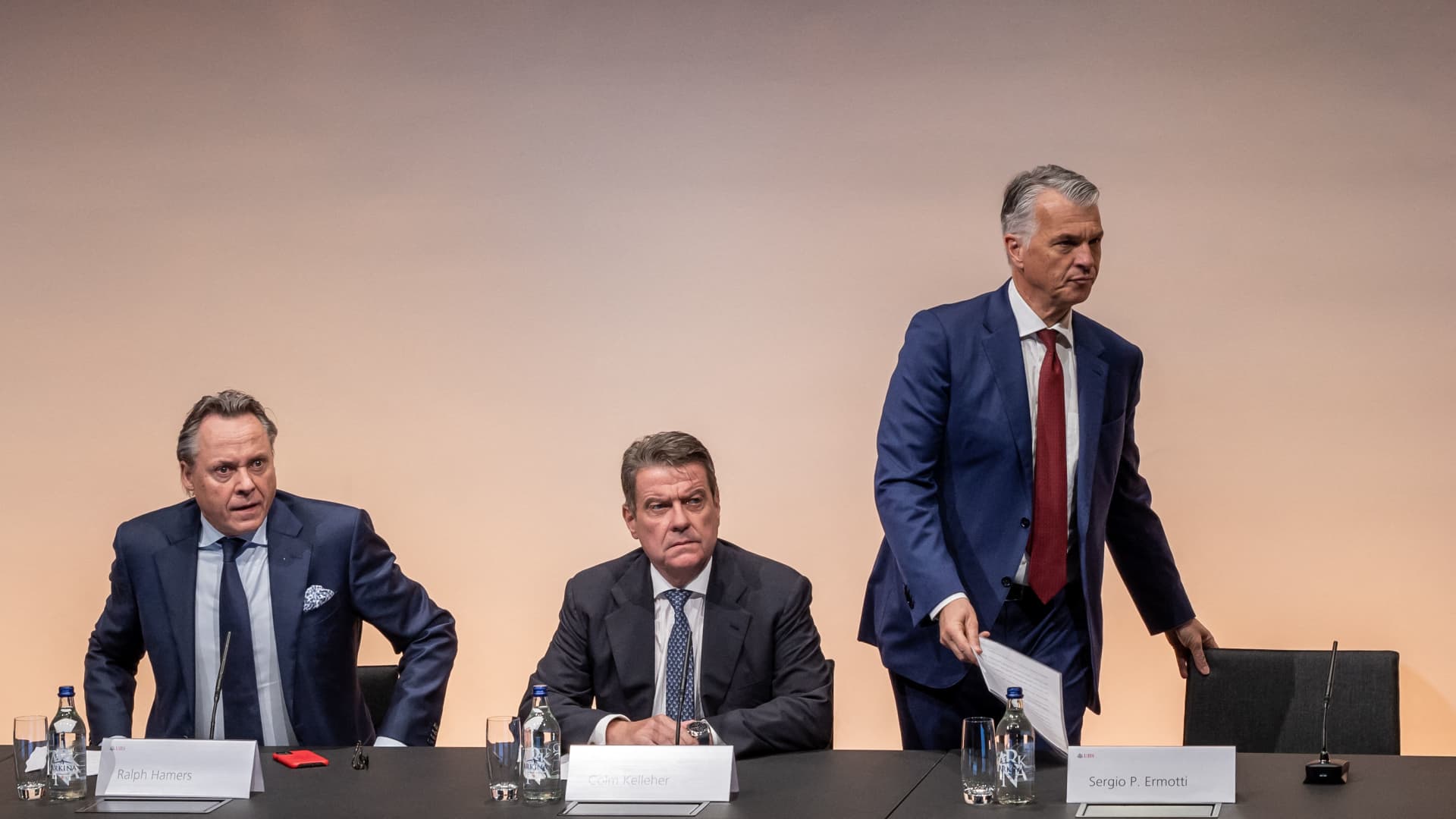 Newly appointed UBS CEO Sergio Ermotti (R) arrives next to UBS Chairman Colm Kelleher (C) and outgoing CEO Ralph Hamers during a press conference in Zurich on March 29, 2023.