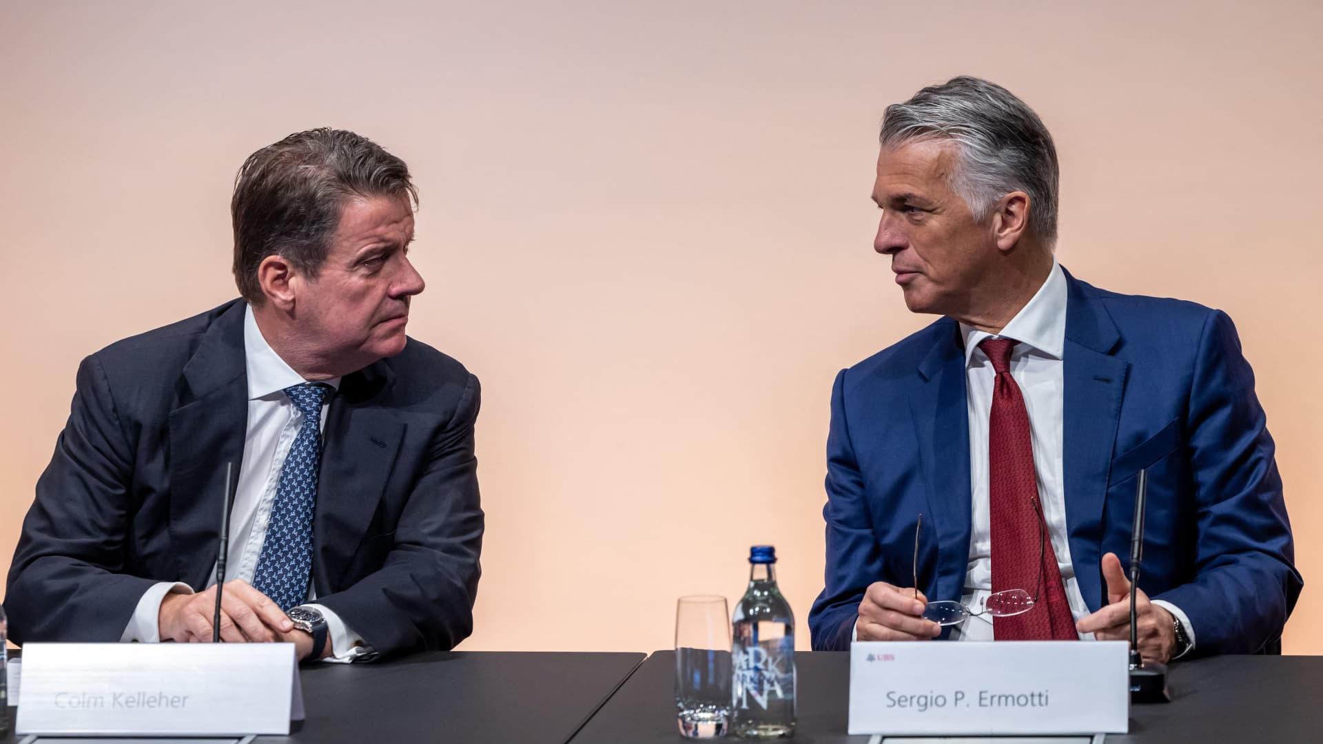 UBS CEO Sergio Ermotti (R) speaks with UBS Chairman Colm Kelleher during a press conference in Zurich on March 29, 2023.