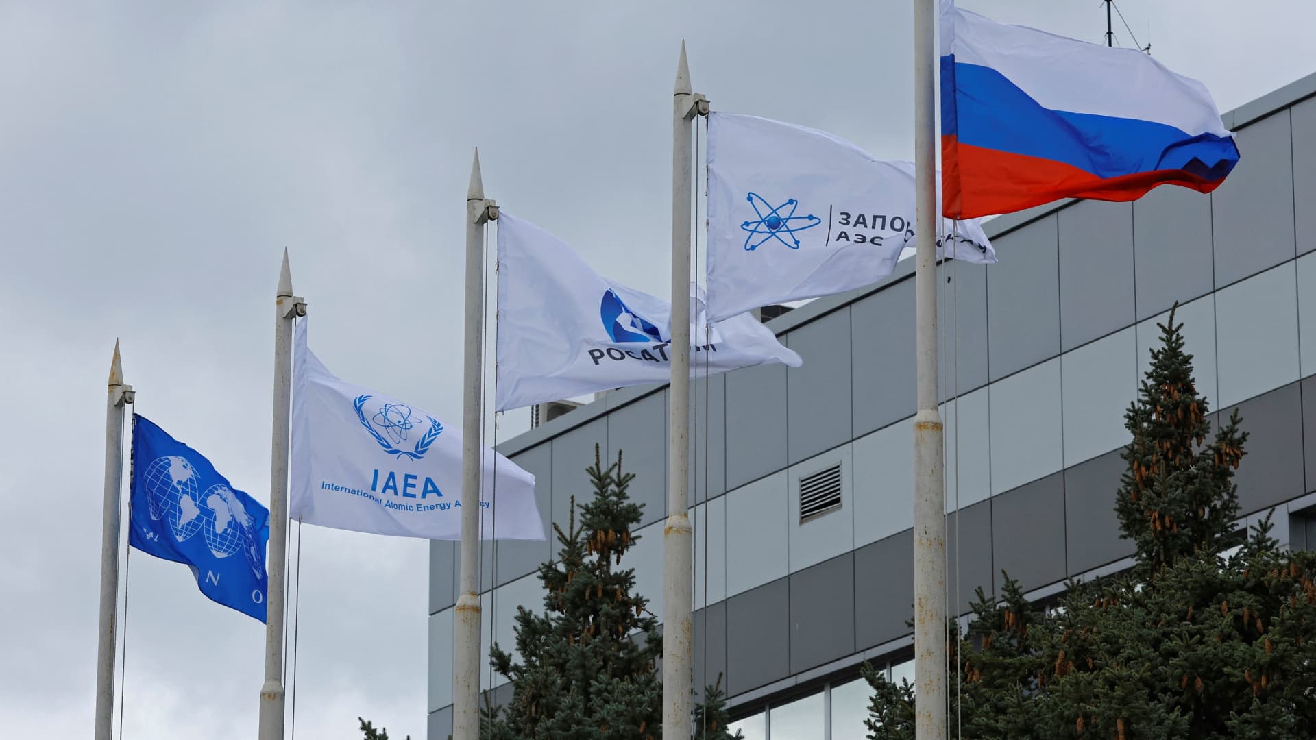 Flags fly in front of the Zaporizhzhia Nuclear Power Plant in the course of Russia-Ukraine conflict outside Enerhodar in the Zaporizhzhia region, Russian-controlled Ukraine, March 29, 2023. 