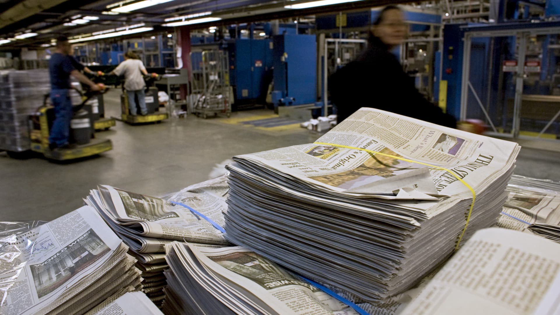 Stacks of The Wall Street Journal newspaper wait to be distributed.