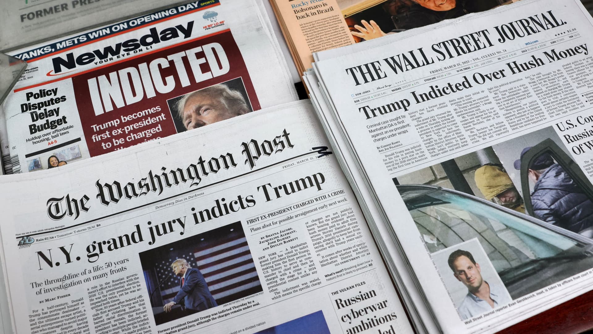 New York newspapers are displayed at a newsstand following former U.S. President Donald Trump's indictment by a Manhattan grand jury following a probe into hush money paid to porn star Stormy Daniels, in New York City, U.S. March 31, 2023. 