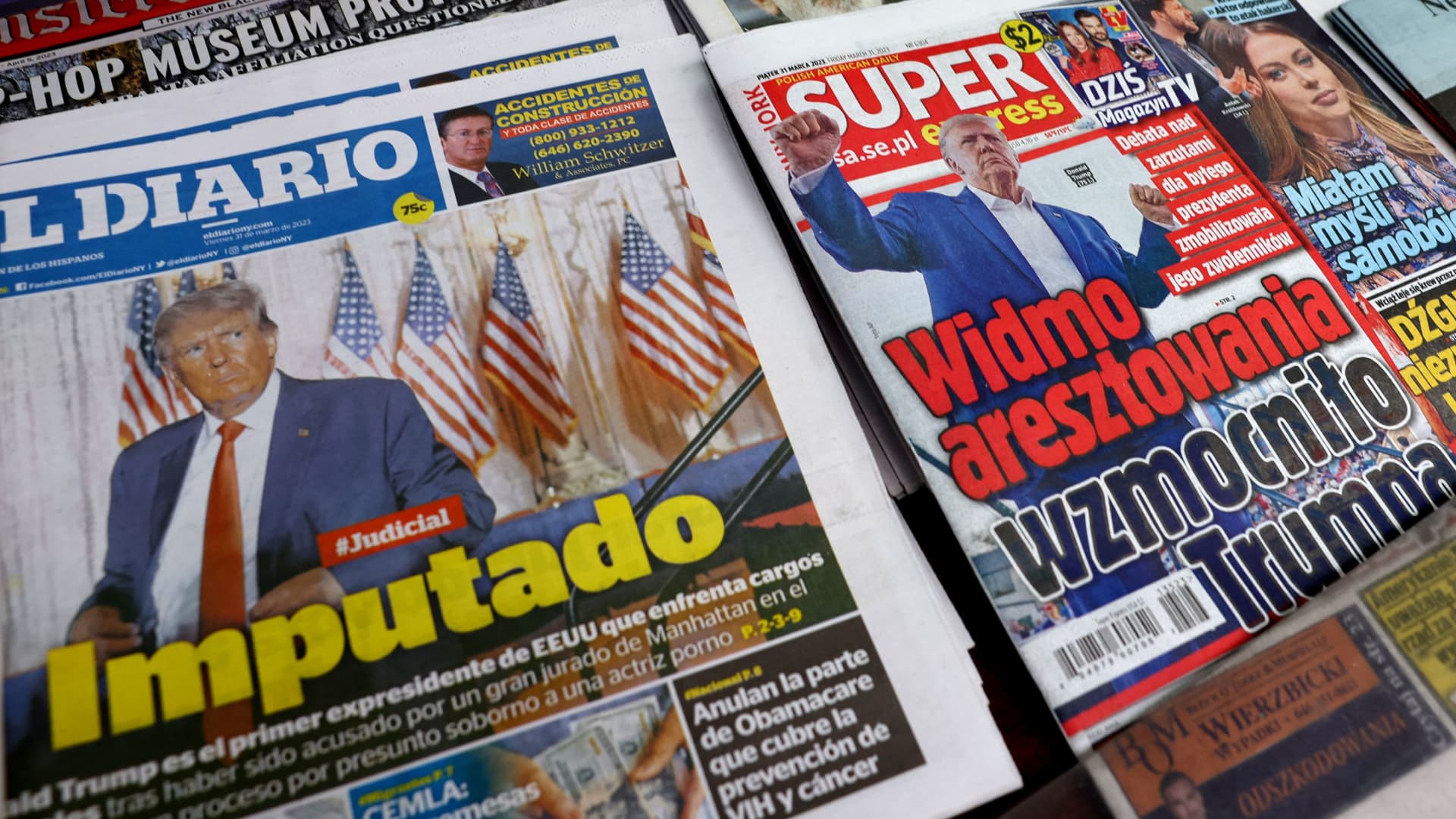 International newspapers are displayed at a newsstand following former U.S. President Donald Trump's indictment by a Manhattan grand jury following a probe into hush money paid to porn star Stormy Daniels, in New York City, U.S. March 31, 2023. 