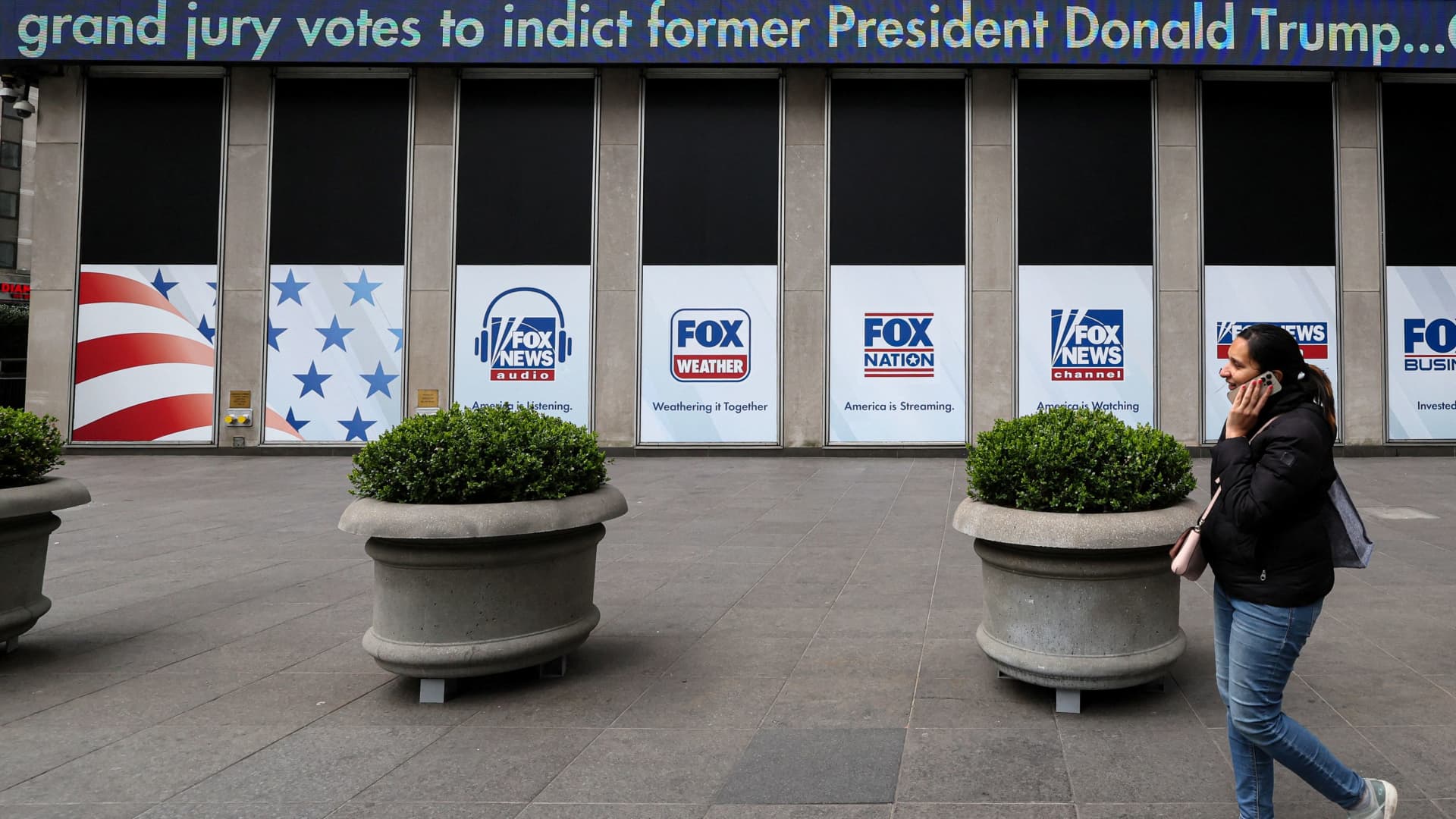 A news ticker outside Fox News headquarters reads: Grand jury votes to indict former President Donald Trump, at the News Corporation building in New York City, U.S., March 31, 2023. 