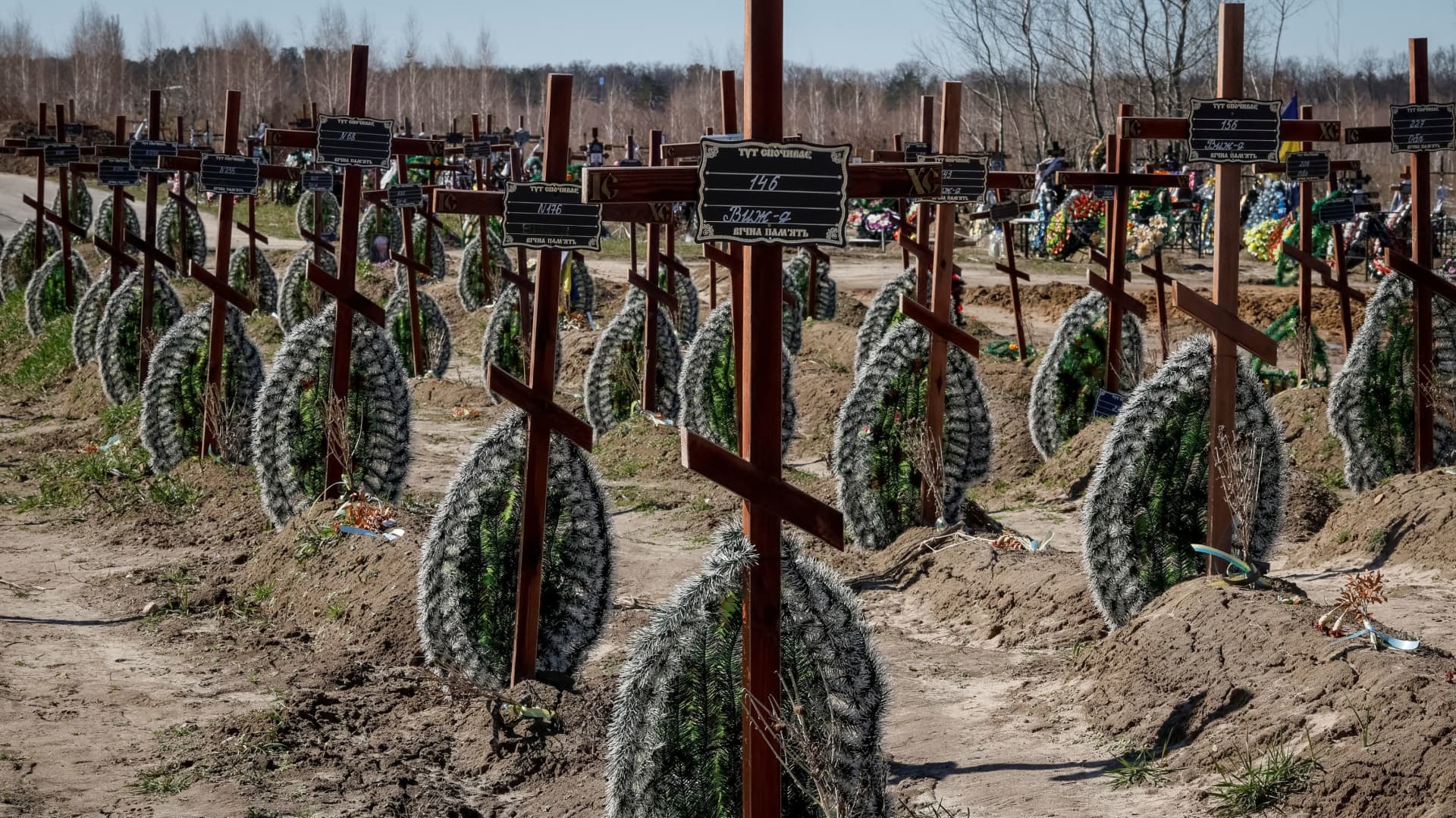 Graves of unidentified people killed by Russian soldiers during occupation of the Bucha town, are seen at the town's cemetery before the first anniversary of its liberation, amid Russia's attack on Ukraine, in the town of Bucha, outside Kyiv, Ukraine March 30, 2023. 