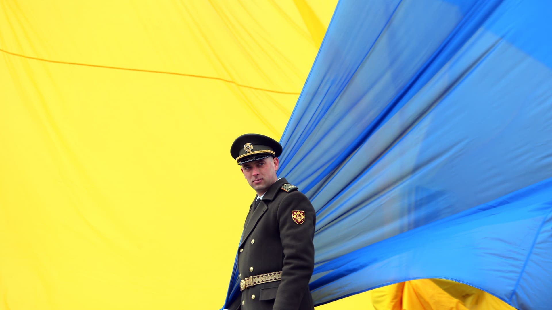 An Ukrainian servicemen waits for national flag raising ceremony as Ukrainian President Volodymyr Zelensky and foreign leaders President of Moldova Maia Sandu, Prime Minister of Croatia Andrej Plenkovic, Prime Minister of Slovenia Robert Golob and Prime Minister of Slovakia Eduard Heger will take part at an event dedicated to the first anniversary of the Bucha liberation from Russian troops, in city of Bucha, not far from Kyiv, Ukraine on 31 March 2023, amid Russia's invasion of Ukraine. 