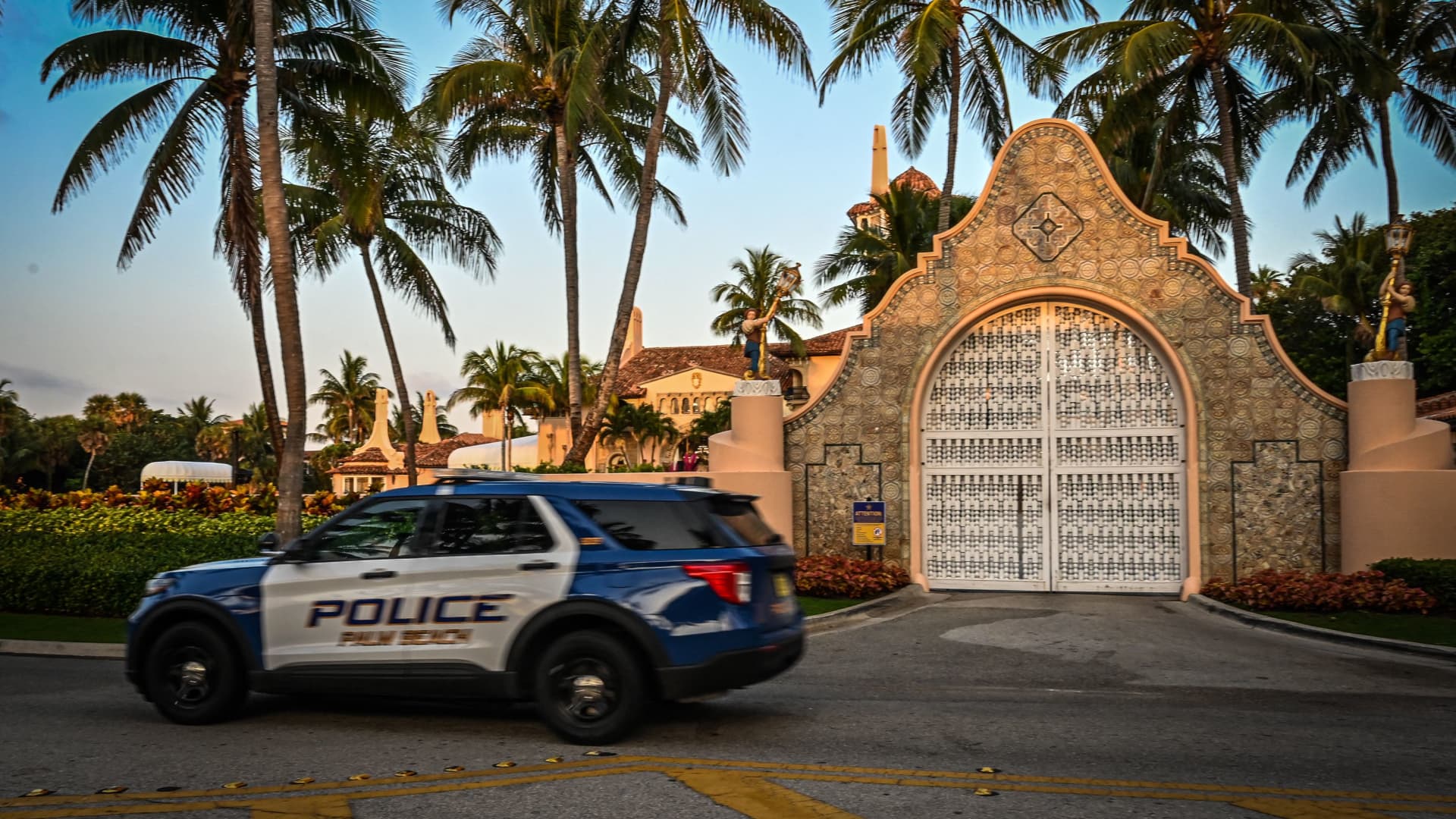 A police car is parked outside the Mar-a-Lago Club, home of former US President Donald Trump, on April 3, 2023 in Palm Beach, Florida.