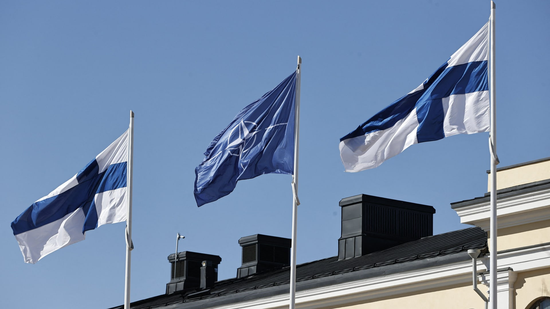 Finnish and Nato flags flutter at the courtyard of the Foreign Ministry in Helsinki, Finland, ahead of accession to the North Atlantic Treaty Organization (NATO) on April 4, 2023.