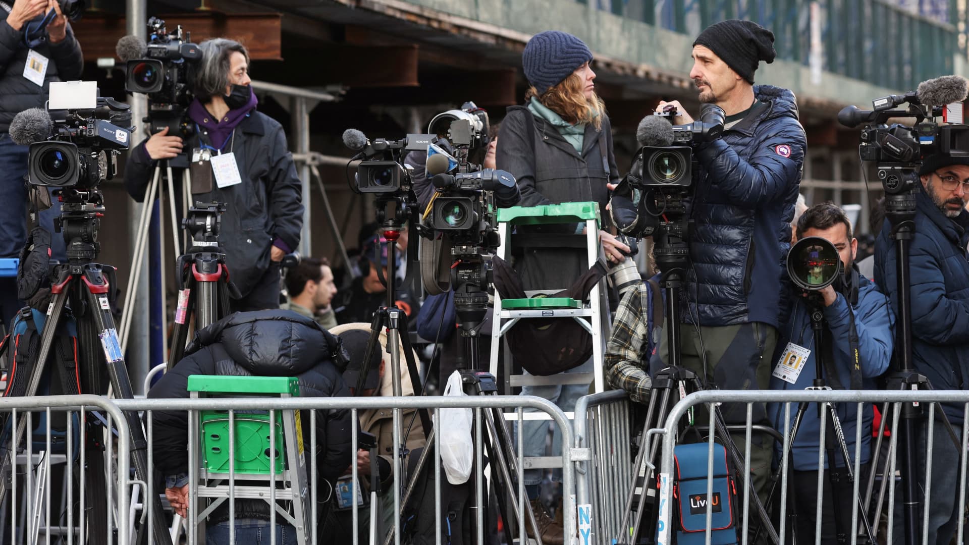 Members of the media wait at their positions outside Manhattan Criminal Courthouse, after Former U.S. President Donald Trump's indictment by a Manhattan grand jury following a probe into hush money paid to porn star Stormy Daniels, in New York City, U.S., April 4, 2023. 