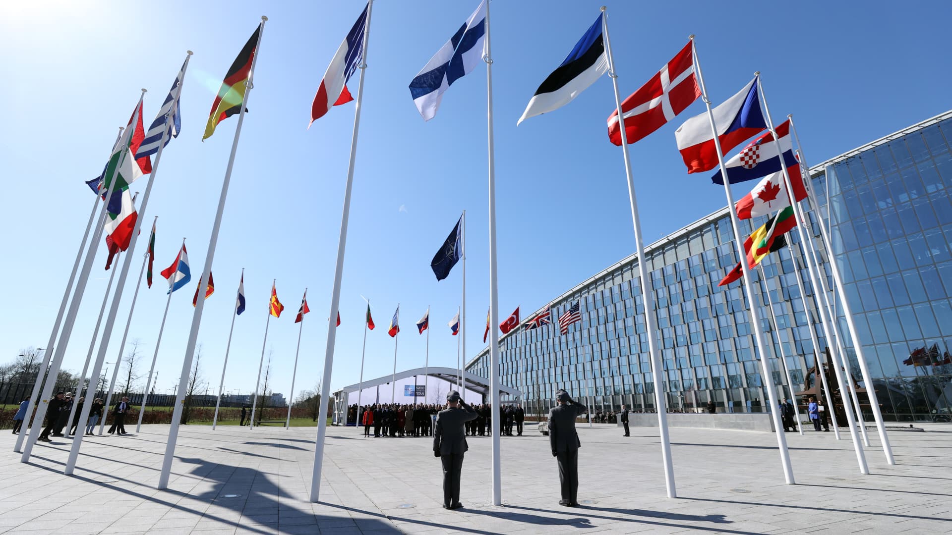 Finnish military personnel install the Finnish national flag at the NATO Headquarters in Brussels, Belgium on April 04, 2023. Finland officially joined NATO on Tuesday (April 4) as Foreign Minister Pekka Haavisto handed the signed accession treaty to US Secretary of State Antony Blinken.