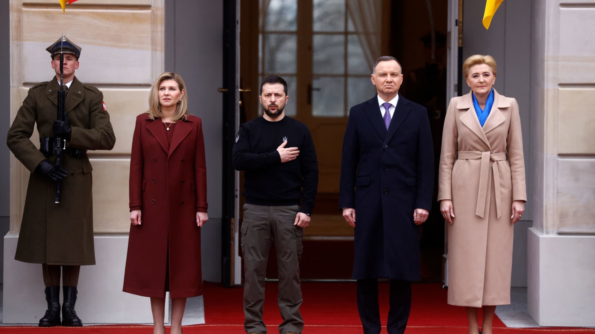 Polish President Andrzej Duda (2ndR) and his wife Agata Kornhauser-Duda (R) together with Ukrainian President Volodymyr Zelensky (C) and his wife Olena Zelenska stand during an official welcoming ceremony in front of the Presidential Palace in Warsaw, Poland, on April 5, 2023. 