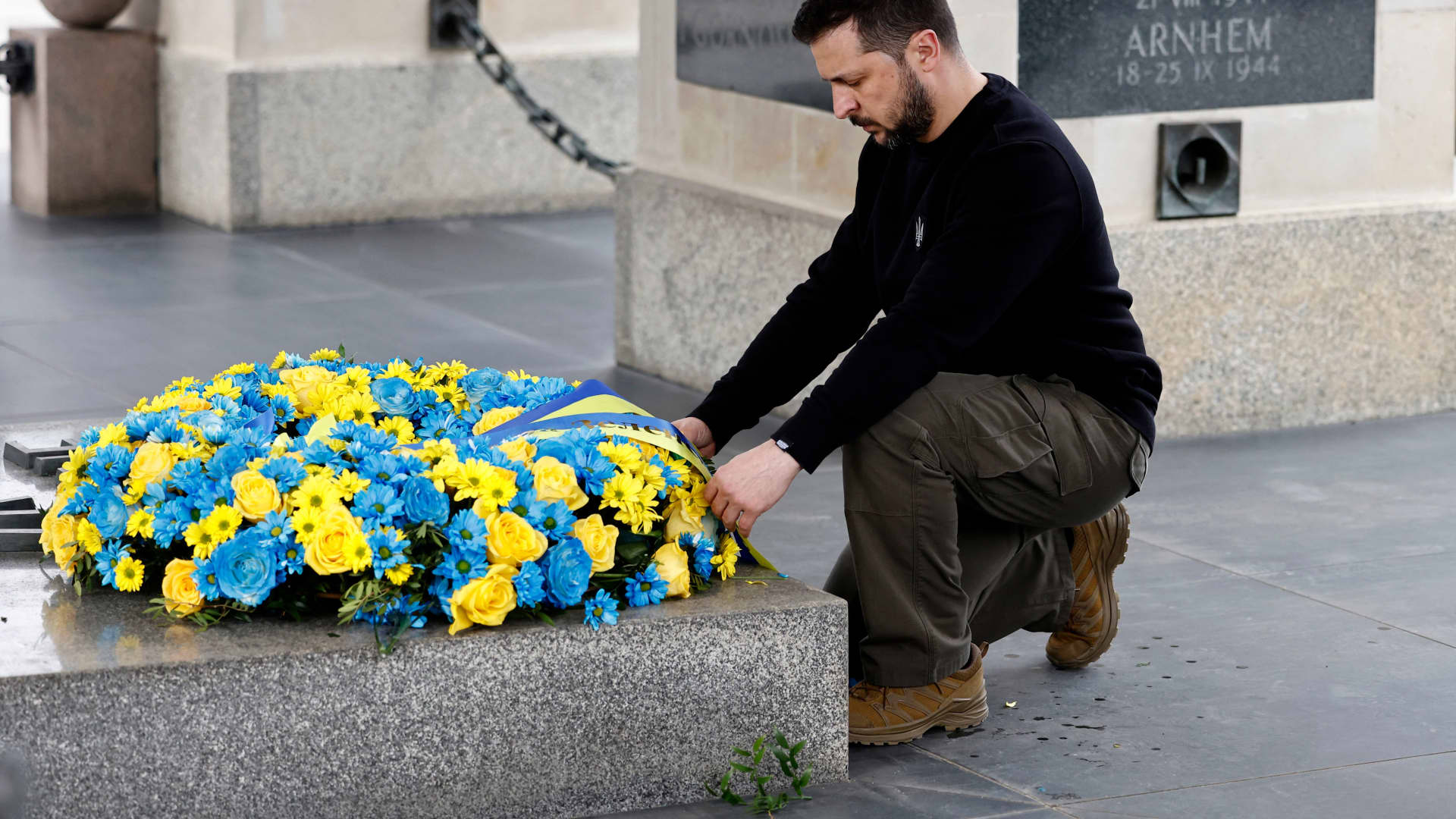 Ukrainian President Volodymyr Zelensky pays his respects during a wreath-laying ceremony at The Tomb of the Unknown Soldier in Warsaw, Poland, on April 5, 2023. 