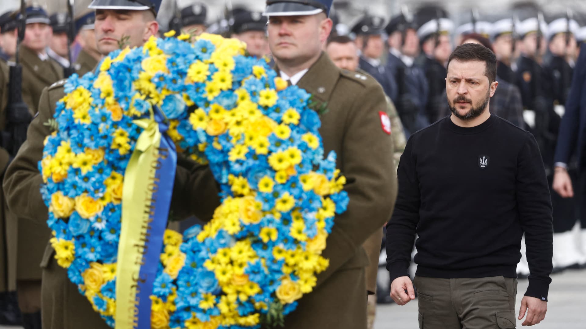 Ukrainian President Volodymyr Zelensky pays his respects during a wreath-laying ceremony at The Tomb of the Unknown Soldier in Warsaw, Poland, on April 5, 2023. 