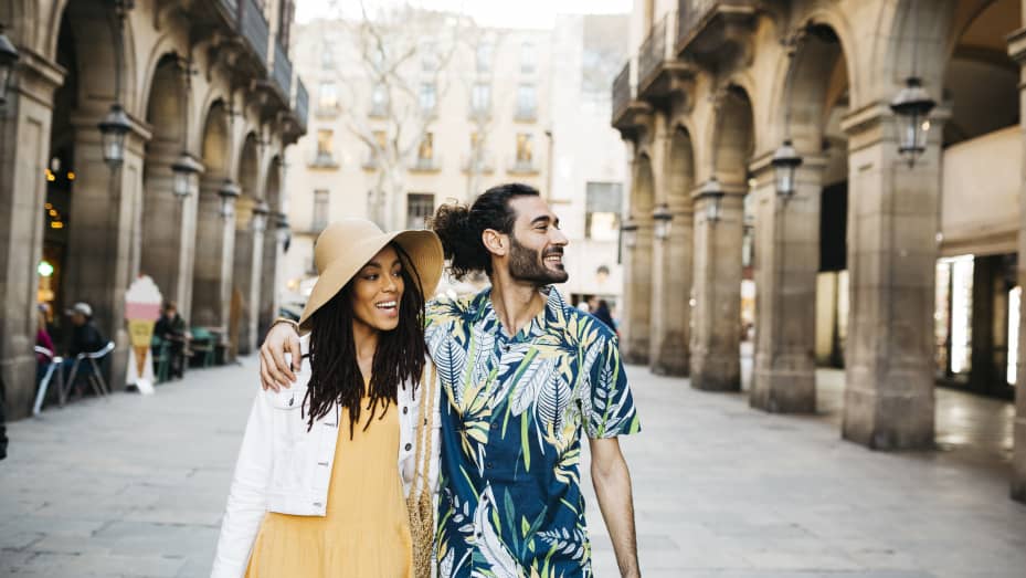 Young couple walking in the city center of Barcelona, Spain