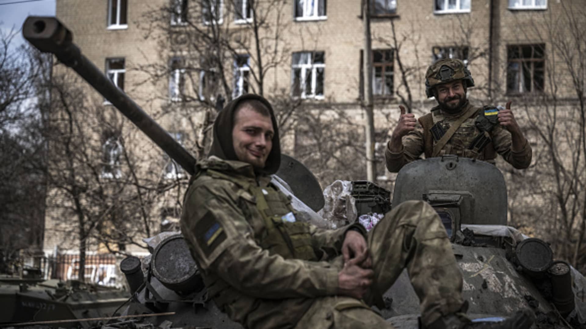 Ukrainian soldiers pose on a tank amid Russia-Ukraine war on the frontline of Donetsk Oblast, Ukraine on March 29, 2023.