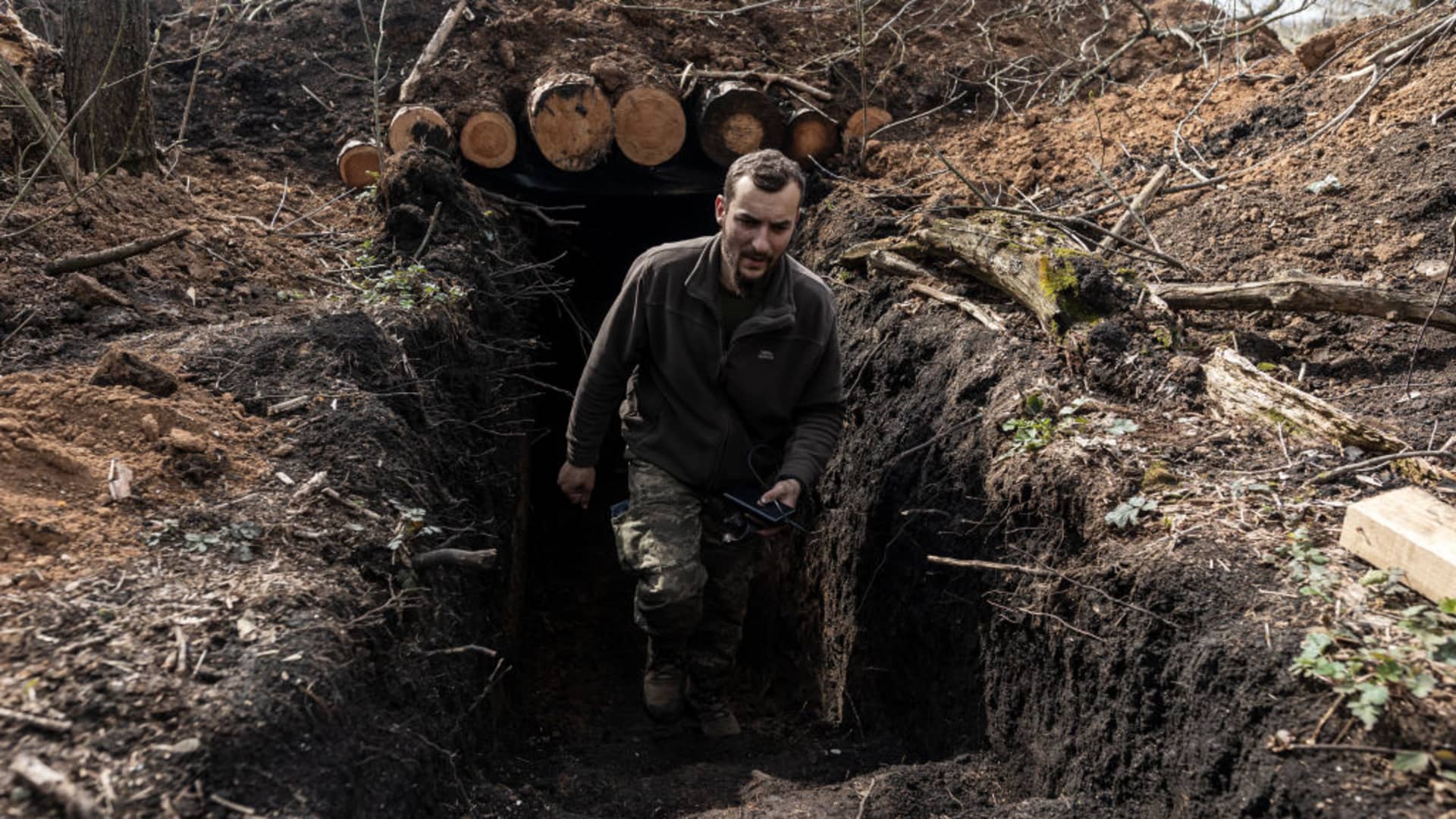 Ukrainian soldier leaves a trench in his fighting position in the direction of Bakhmut, 5 April 2023, as Russia-Ukraine war continues. 