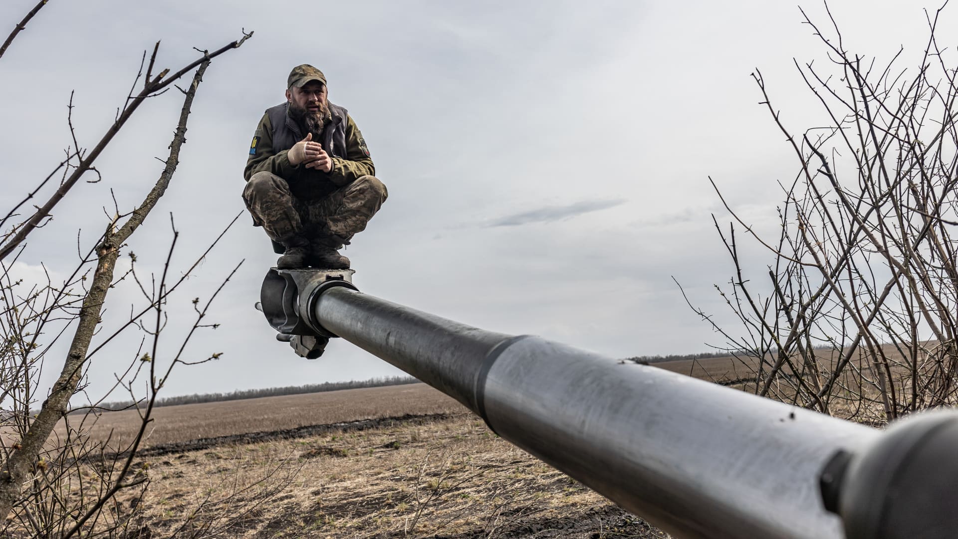 A Ukrainian soldier is seen on an artillery gun amid Russia-Ukraine war in the direction of Bakhmut, Ukraine on April 5, 2023. 