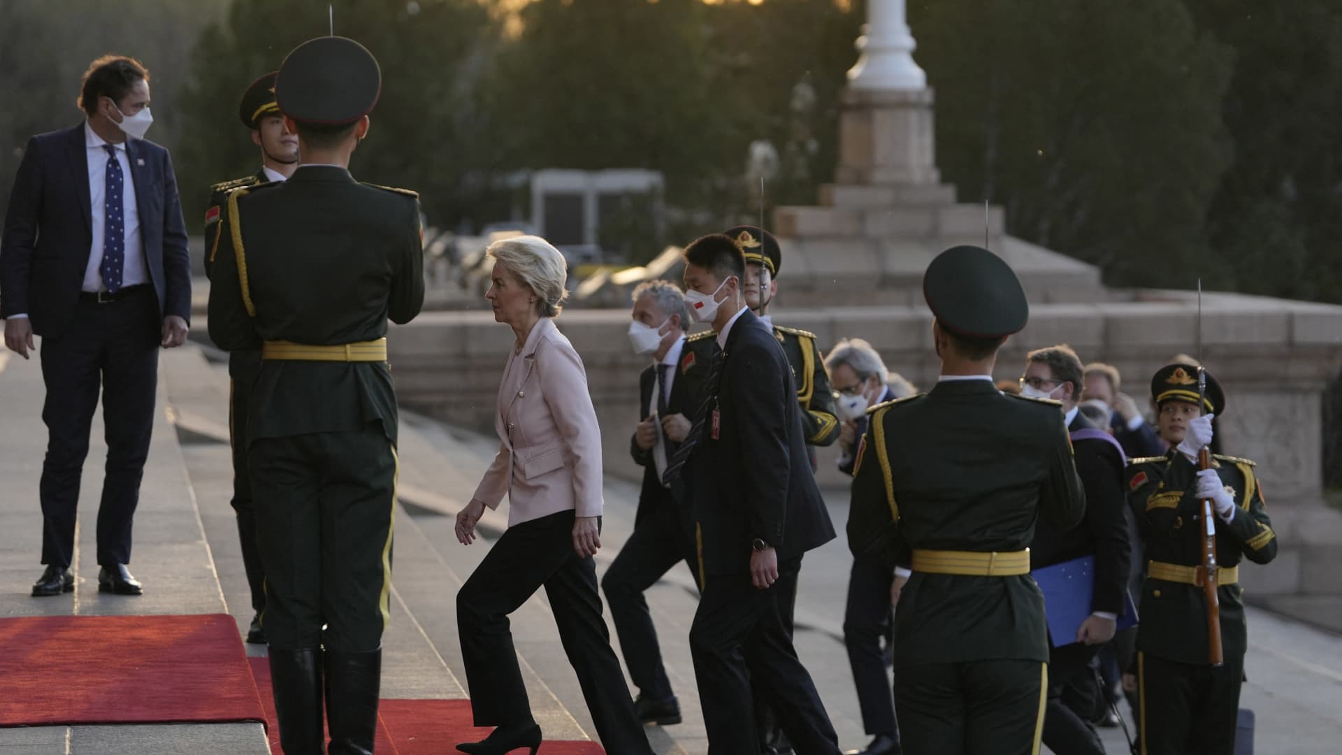 European Commission President Ursula von der Leyen (C) arrives for a meeting with Chinese President Xi Jinping and France's President Emmanuel Macron at the Great Hall of the People in Beijing on April 6, 2023.