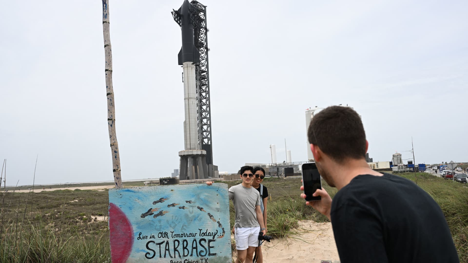 People take pictures of the rocket garden ahead of the SpaceX Starship flight test from Starbase in Boca Chica, Texas on April 16, 2023. 