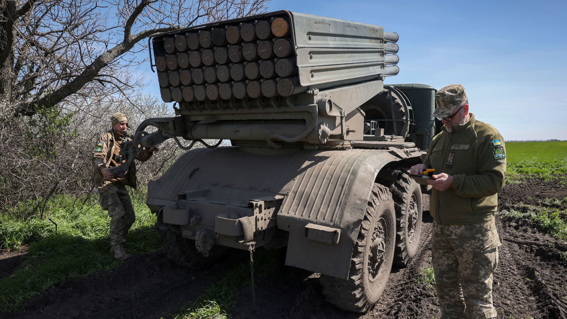 Ukrainian artillerymen prepare a BM-21 Grad multiple rocket launcher to fire towards Russian positions on the frontline, in Donetsk region on April 17, 2023. 