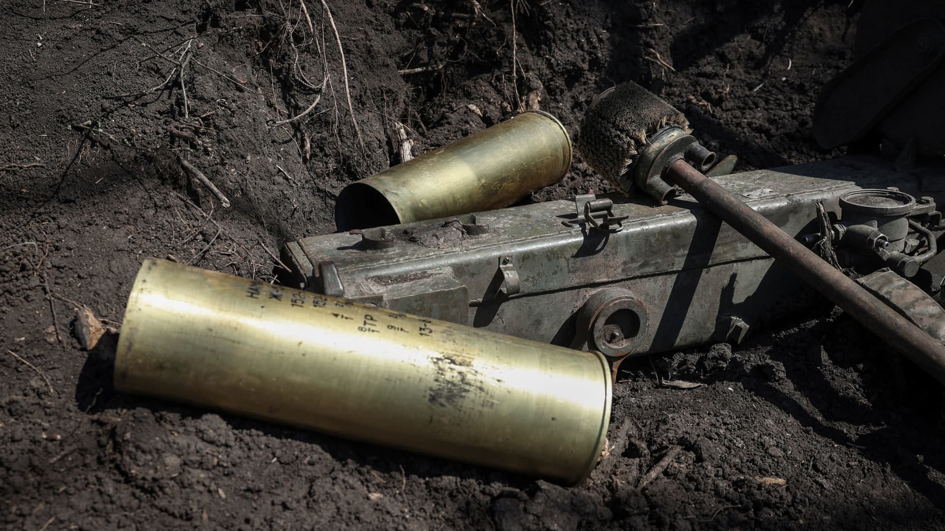 Artillery shell cases are seen on the ground during shelling by Ukranian forces towards Russian positions on the frontline, in Donetsk region on April 17, 2023. 