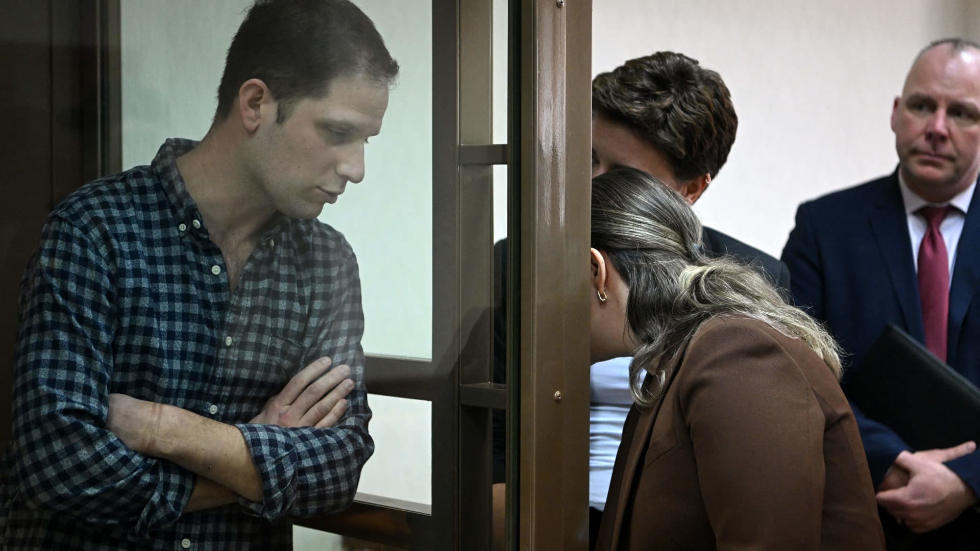 US journalist Evan Gershkovich, arrested on espionage charges, stands inside a defendants' cage before a hearing to consider an appeal on his arrest at the Moscow City Court in Moscow on April 18, 2023. 