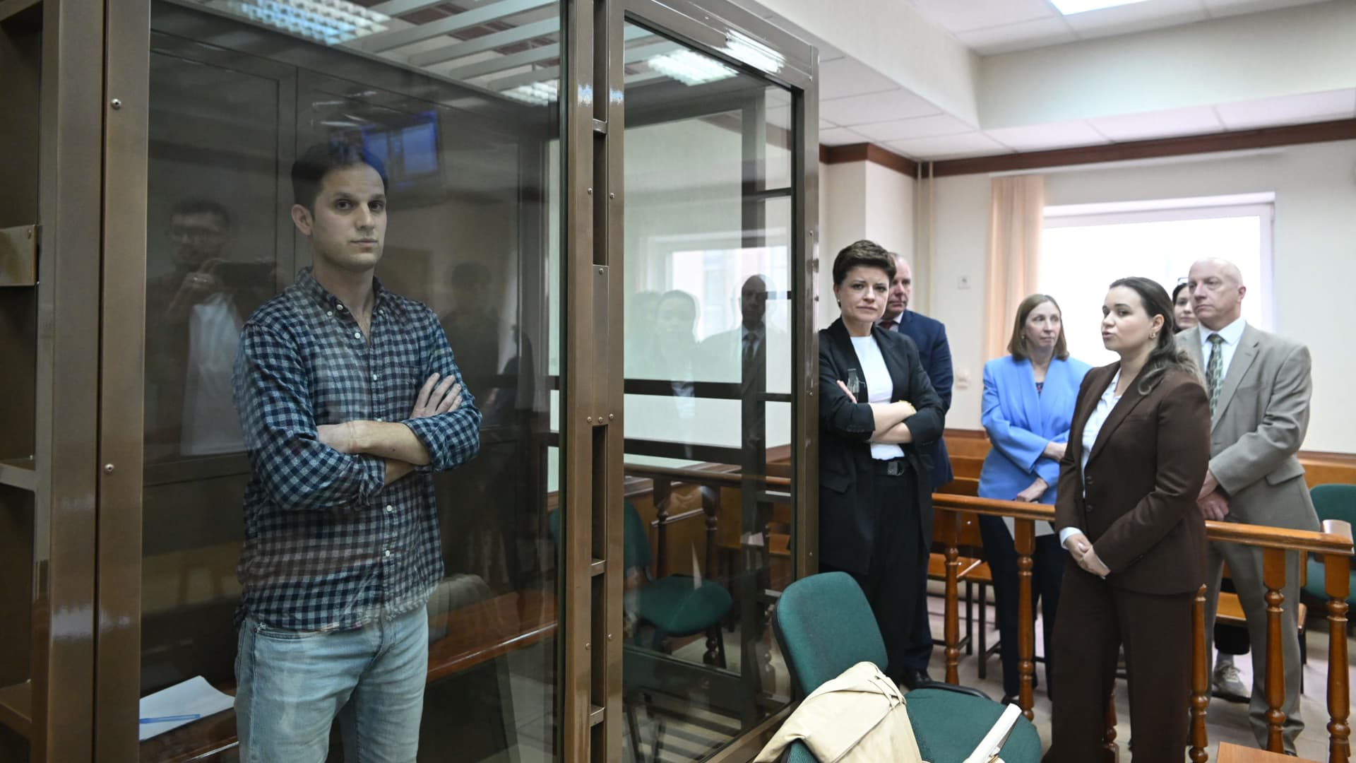 U.S. journalist Evan Gershkovich, arrested on espionage charges, stands inside a defendants' cage before a hearing to consider an appeal on his arrest at the Moscow City Court on April 18, 2023.