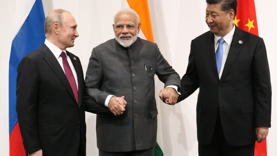 OSAKA, JAPAN - JUNE 28: Russian President Vladimir Putin, Indian Prime Minister Narendra Modi and Chinese President Xi Jinping pose for a group photo prior to their trilateral meeting at the G20 Osaka Summit 2019 on June 28, 2019 in Osaka, Japan. (Photo by Mikhail Svetlov/Getty Images)