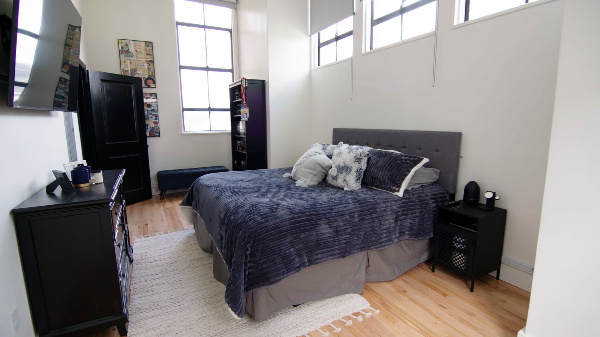 Bedrooms have a lot of natural light thanks to the old high school's large windows.