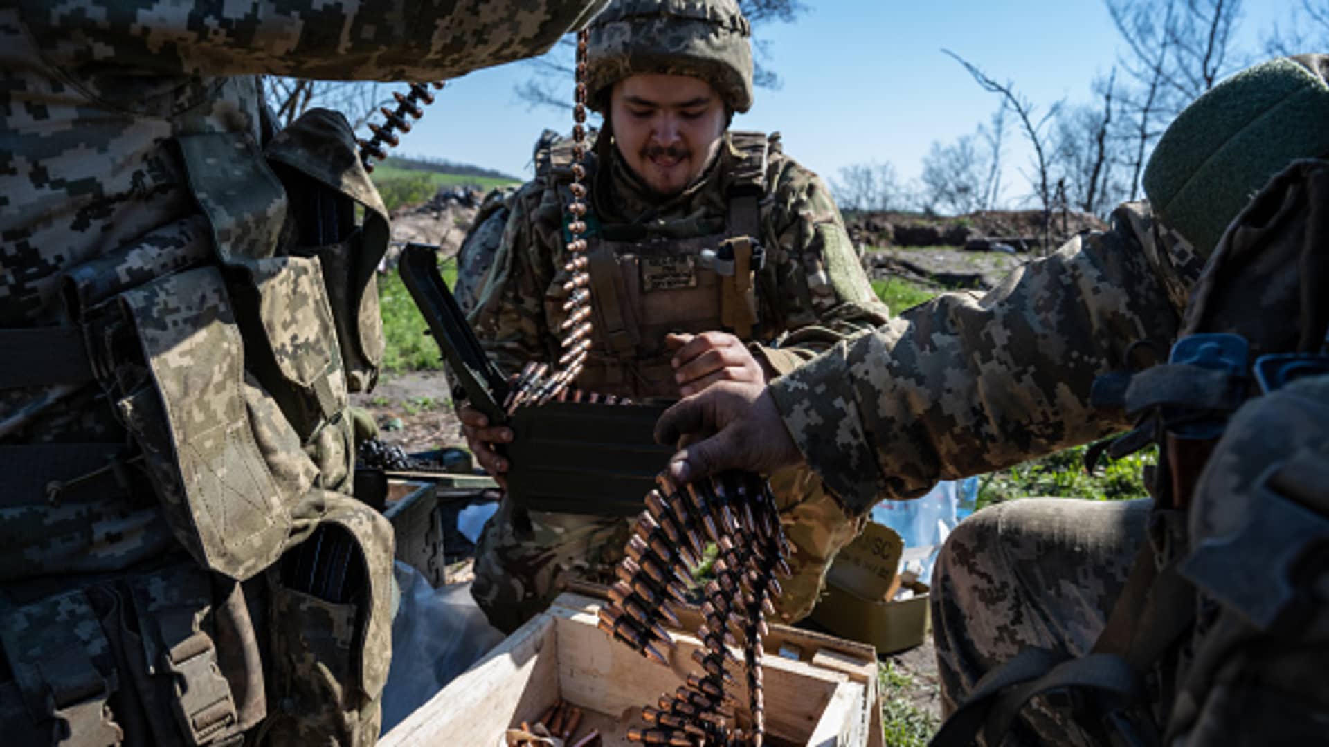 Ukrainian soldiers from the 28th Brigade put bullets into clips for use with light machine guns, as Ukrainian Armed Forces units train for a critical and imminent spring counteroffensive against Russian troops, which invaded 14 months earlier, in the Donbas region, Ukraine, on April 26, 2023. 