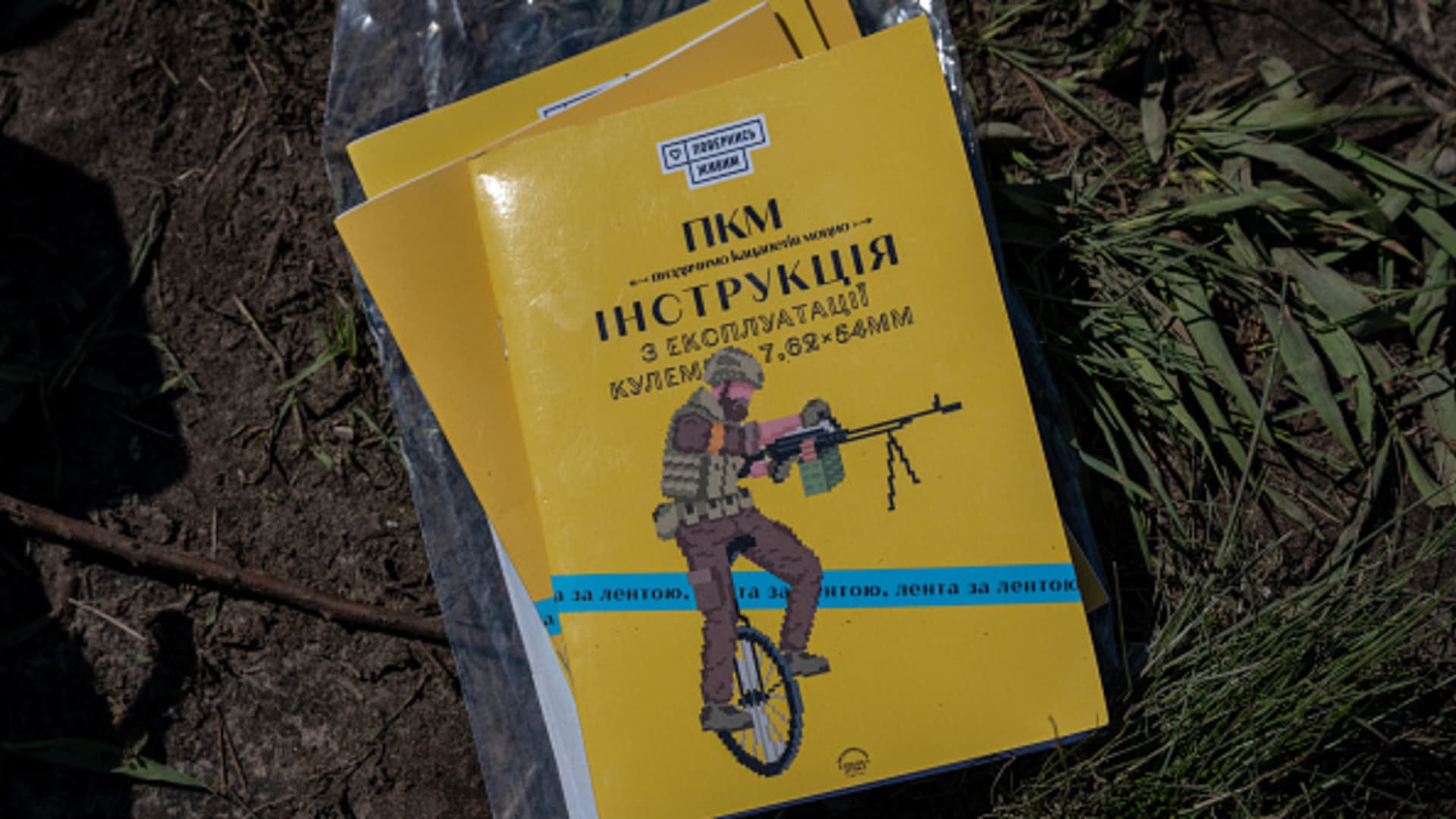Ukrainian soldiers receive two new Czech PMK light machine guns, along with these instruction books, as part of a 1,500-gun consignment organized by Save Life, a Ukrainian group that collects donations for the military, as Ukrainian Armed Forces brigades train for a critical and imminent spring counteroffensive against Russian troops, which invaded 14 months earlier, in the Donbas region, Ukraine, on April 26, 2023. 