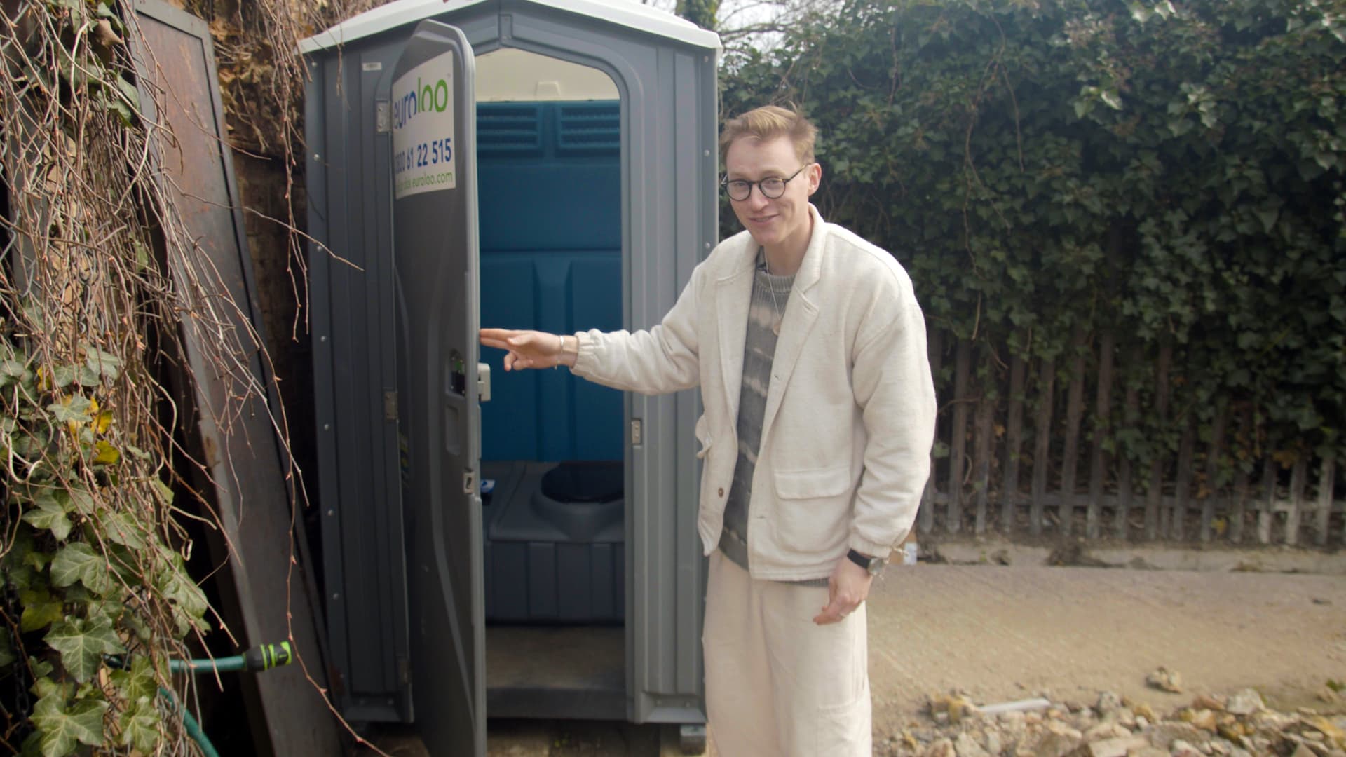 Harrison's toilet is outside of the tiny home.